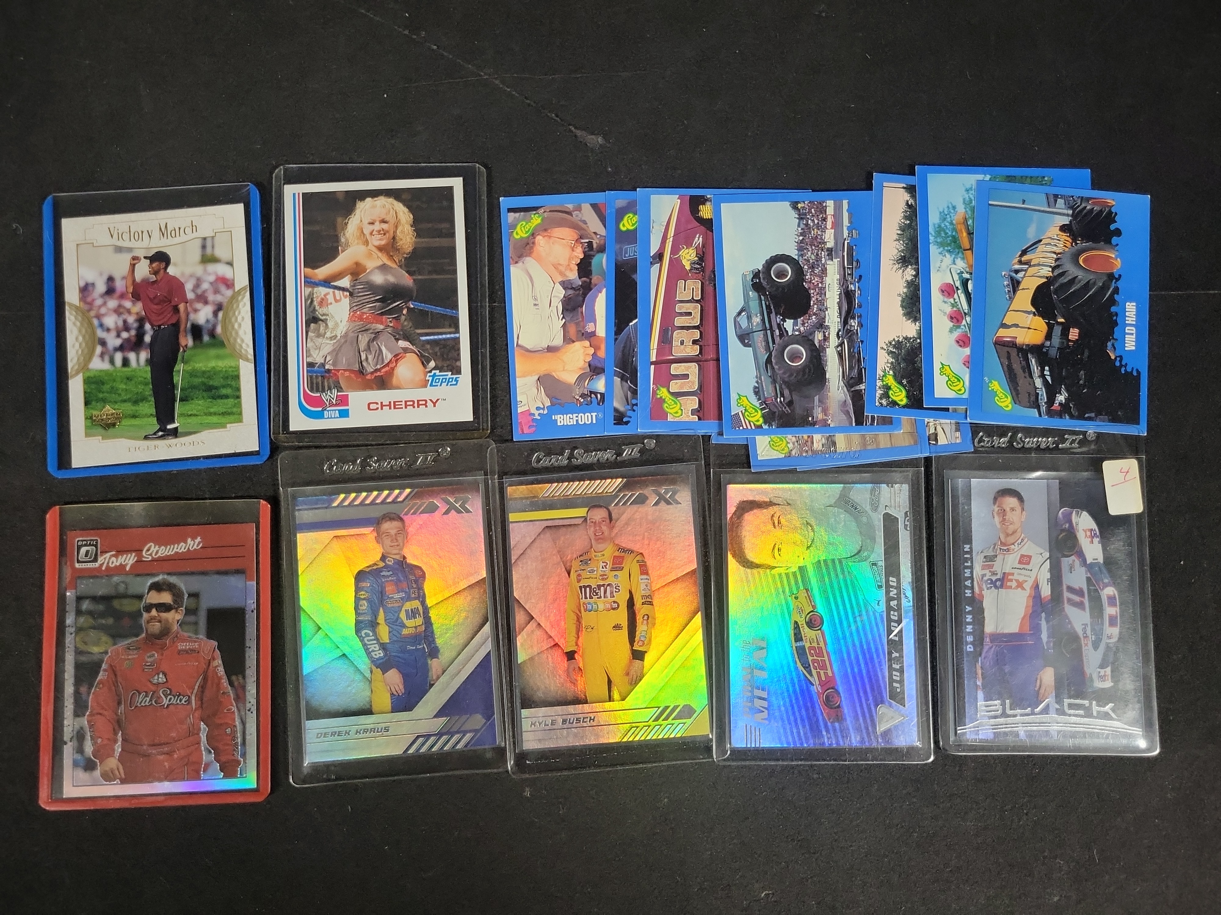 I03841 | An Assortment of NASCAR Tiger Woods Golf WWE and Monster Truck Trading Cards