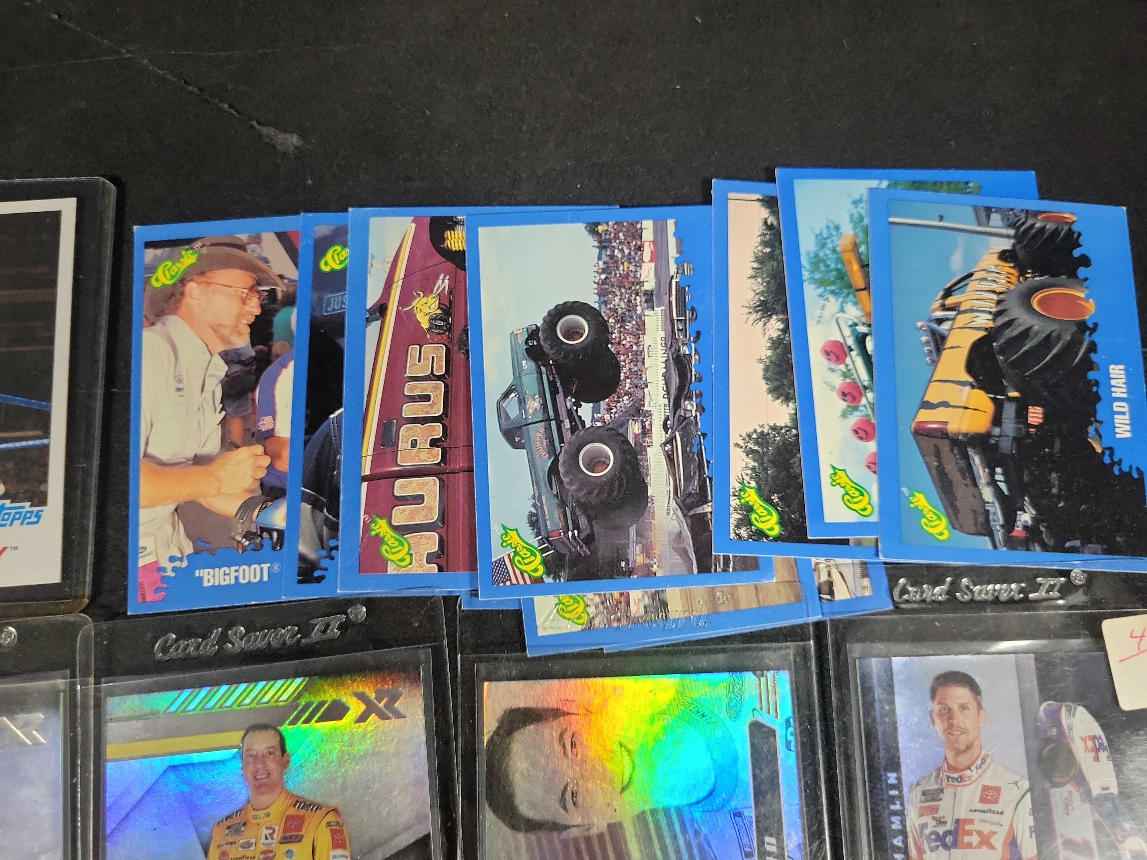 I03841 | An Assortment of NASCAR Tiger Woods Golf WWE and Monster Truck Trading Cards