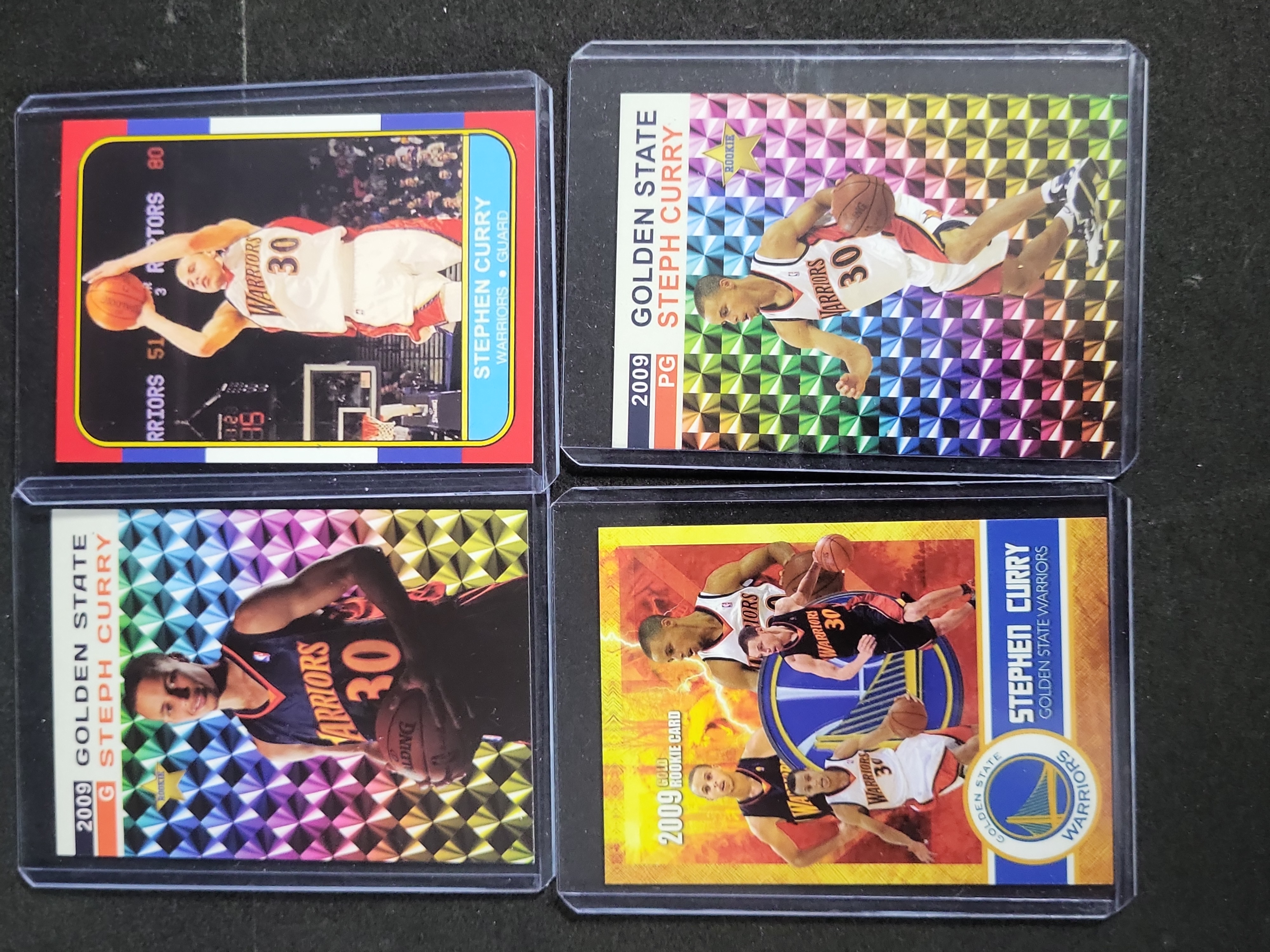 I03271 | A Collection of Four Stephen Curry Unlicensed Custom and Tribute Rookie Style Basketball Cards
