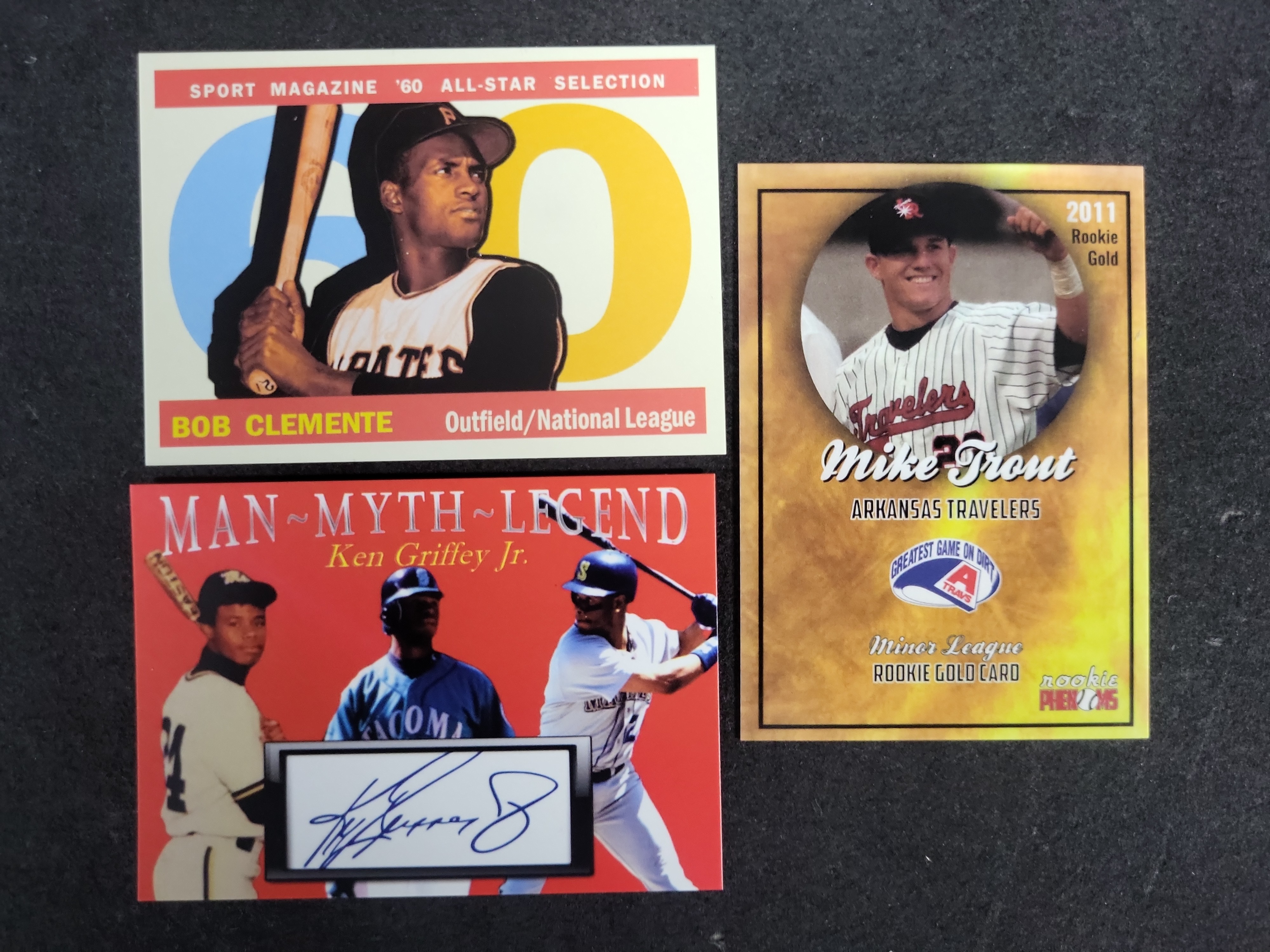 I03584 | A Trio of Baseball Trading Cards Featuring Bob Clemente, Ken Griffey Jr., and Mike Trout