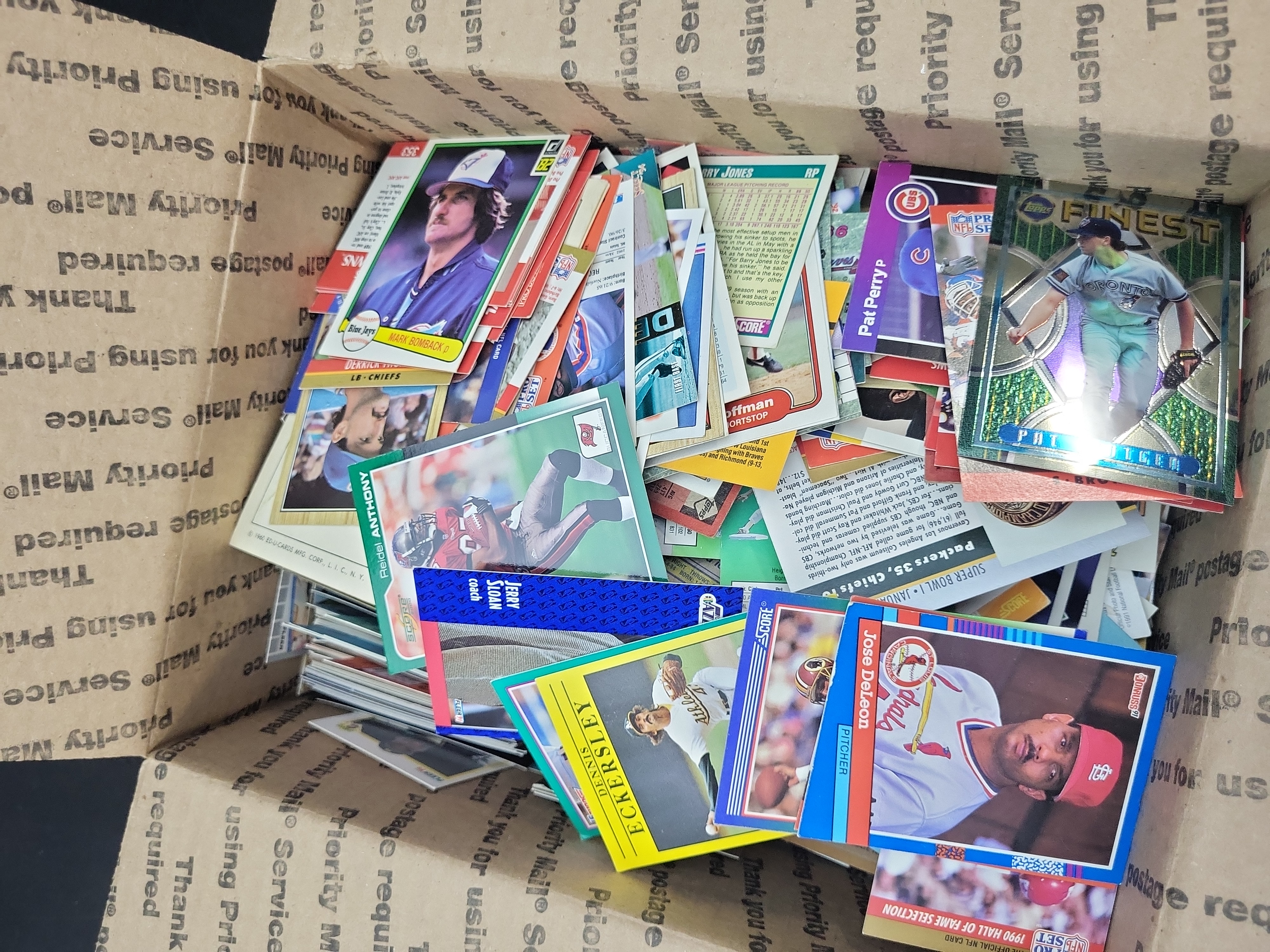 I03329 | An Assortment of Vintage Sports Trading Cards Including Baseball, Football, and Basketball, circa 1970s-1990s