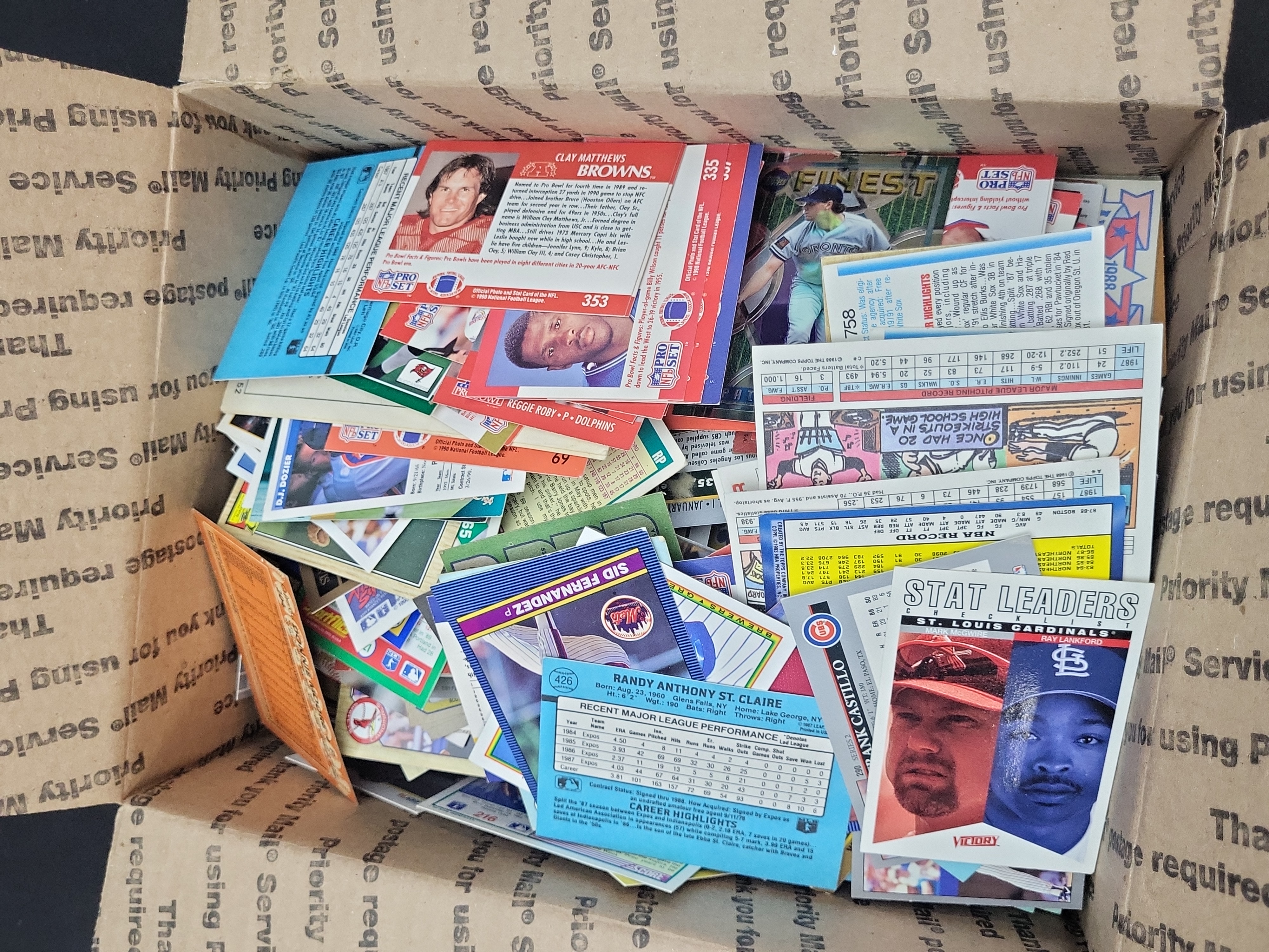 I03329 | An Assortment of Vintage Sports Trading Cards Including Baseball, Football, and Basketball, circa 1970s-1990s