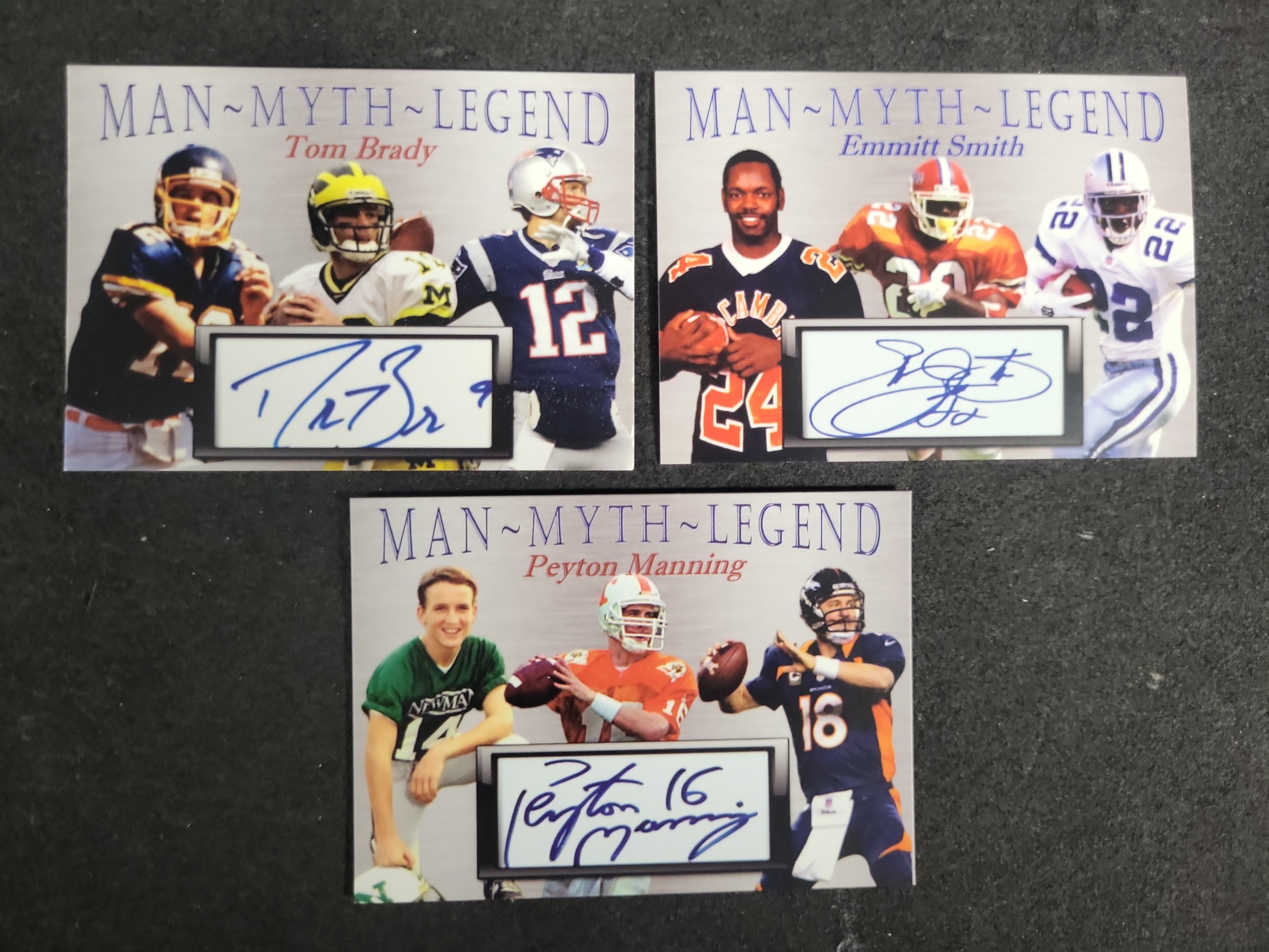 I03593 | A Trio of Man-Myth-Legend Football Cards Featuring Facsimile Cut Autographs of Tom Brady Emmitt Smith and Peyton Manning