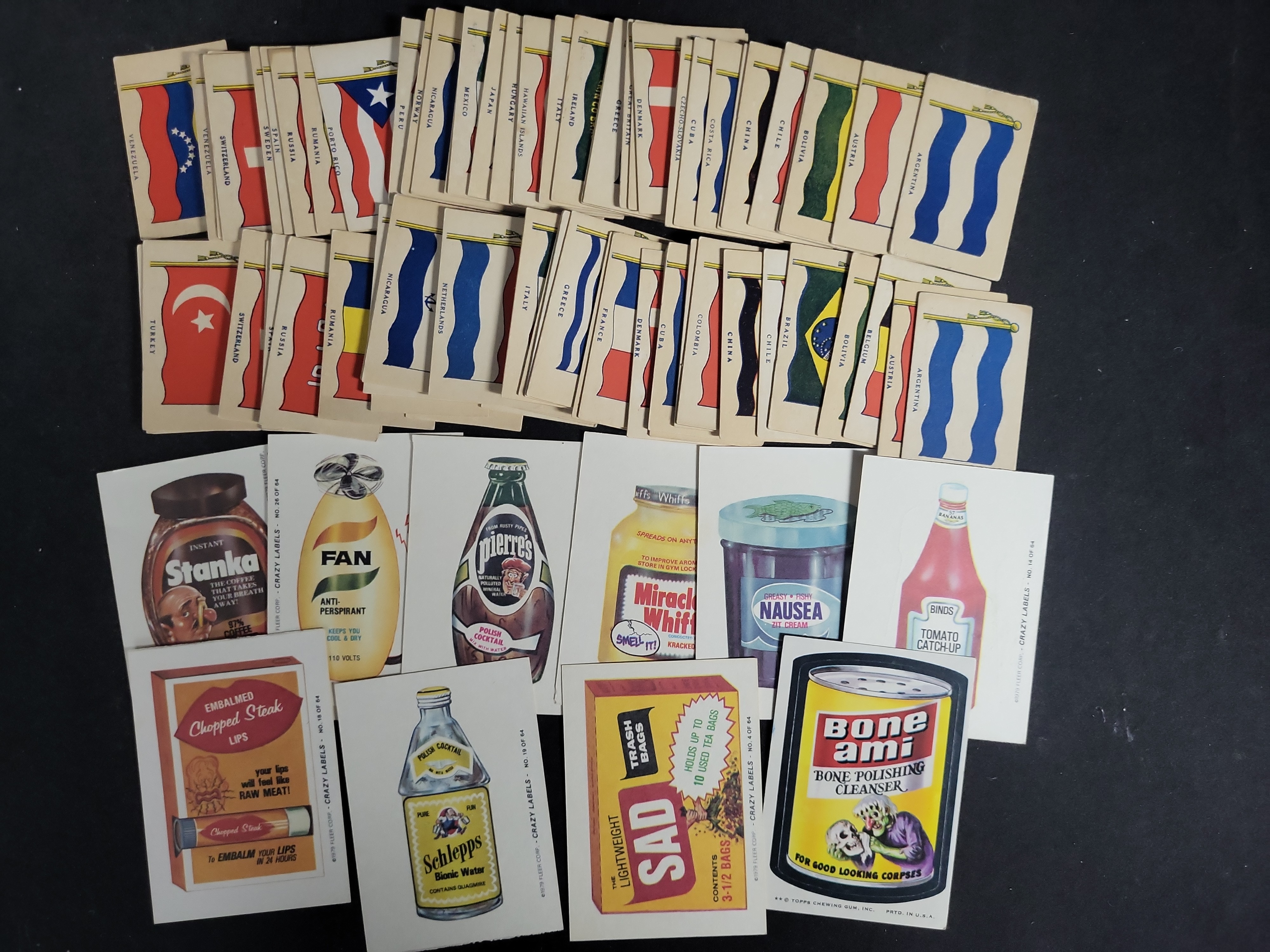 I03448 | A Collection of Vintage National Flag Cards and 1970s Parody Sticker Cards Including Topps Wacky Packages and Fleer Crazy Labels