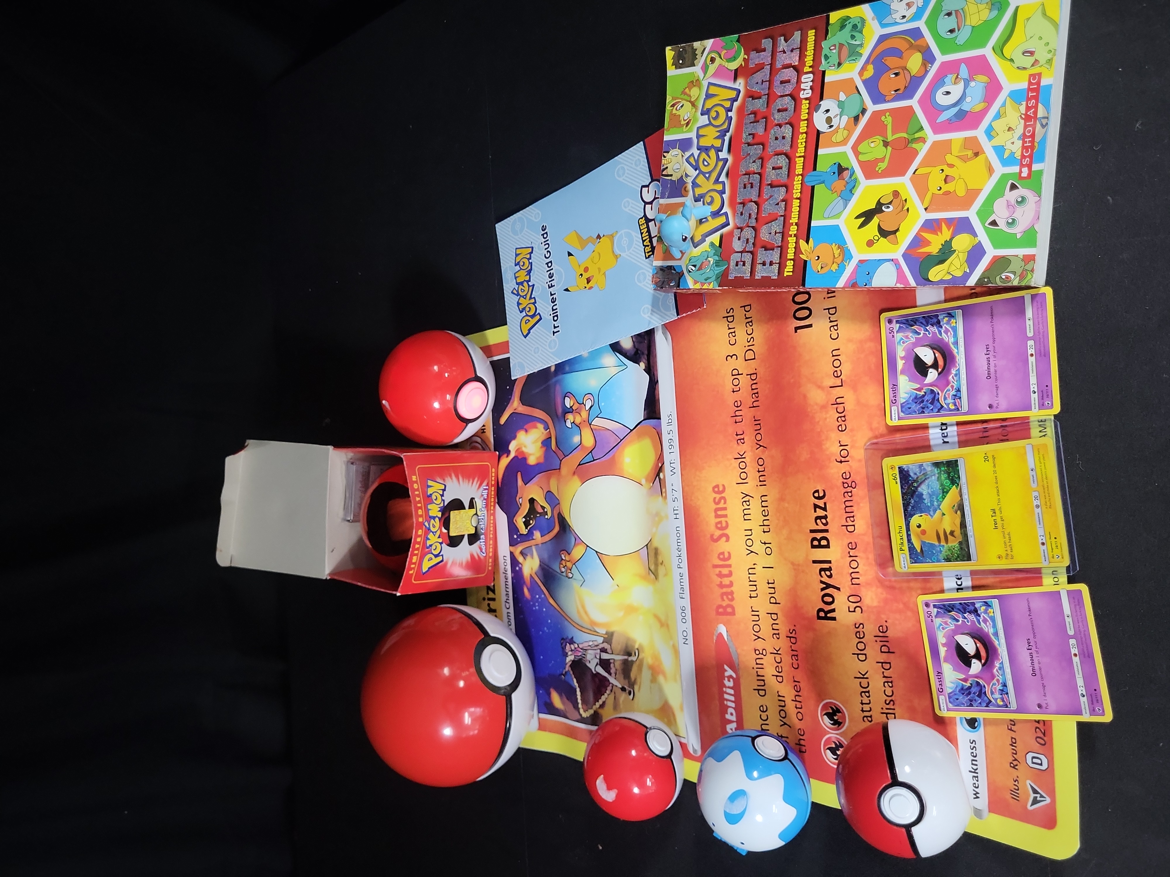 I02792 | A Collection of Pokémon Trading Cards and Collectibles Including 23K Gold-Plated Promotional Card and Handbooks