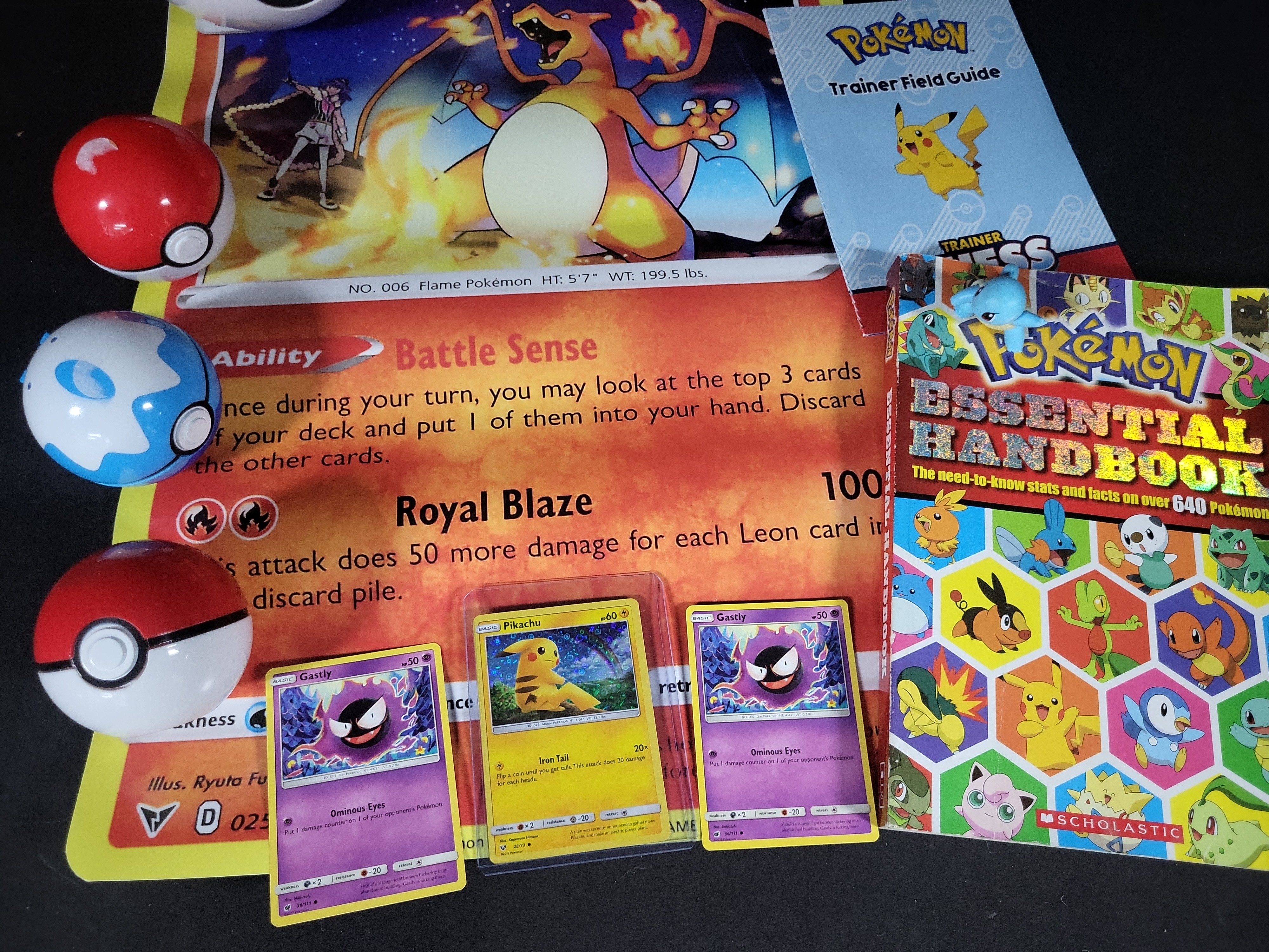 I02792 | A Collection of Pokémon Trading Cards and Collectibles Including 23K Gold-Plated Promotional Card and Handbooks