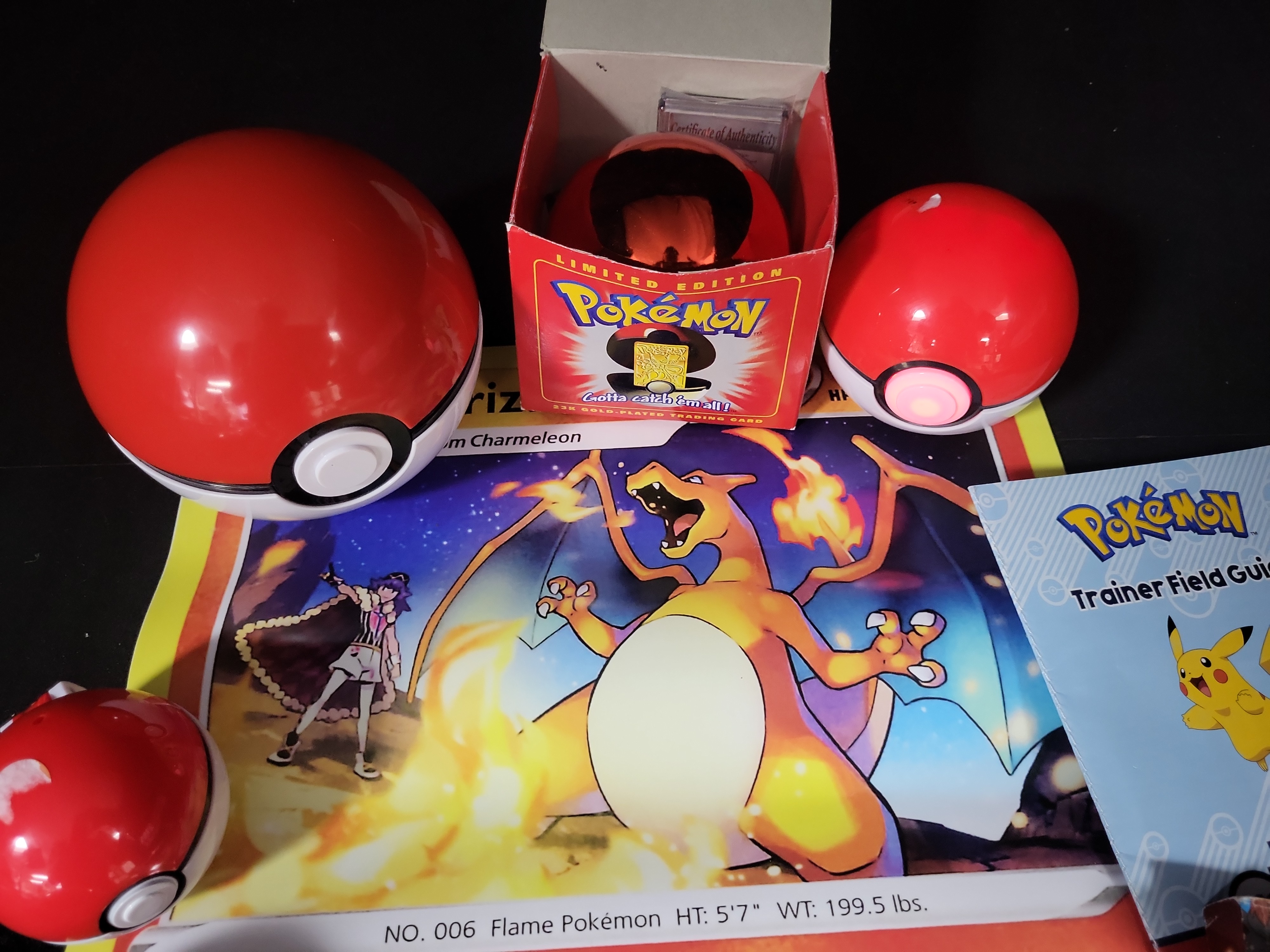 I02792 | A Collection of Pokémon Trading Cards and Collectibles Including 23K Gold-Plated Promotional Card and Handbooks