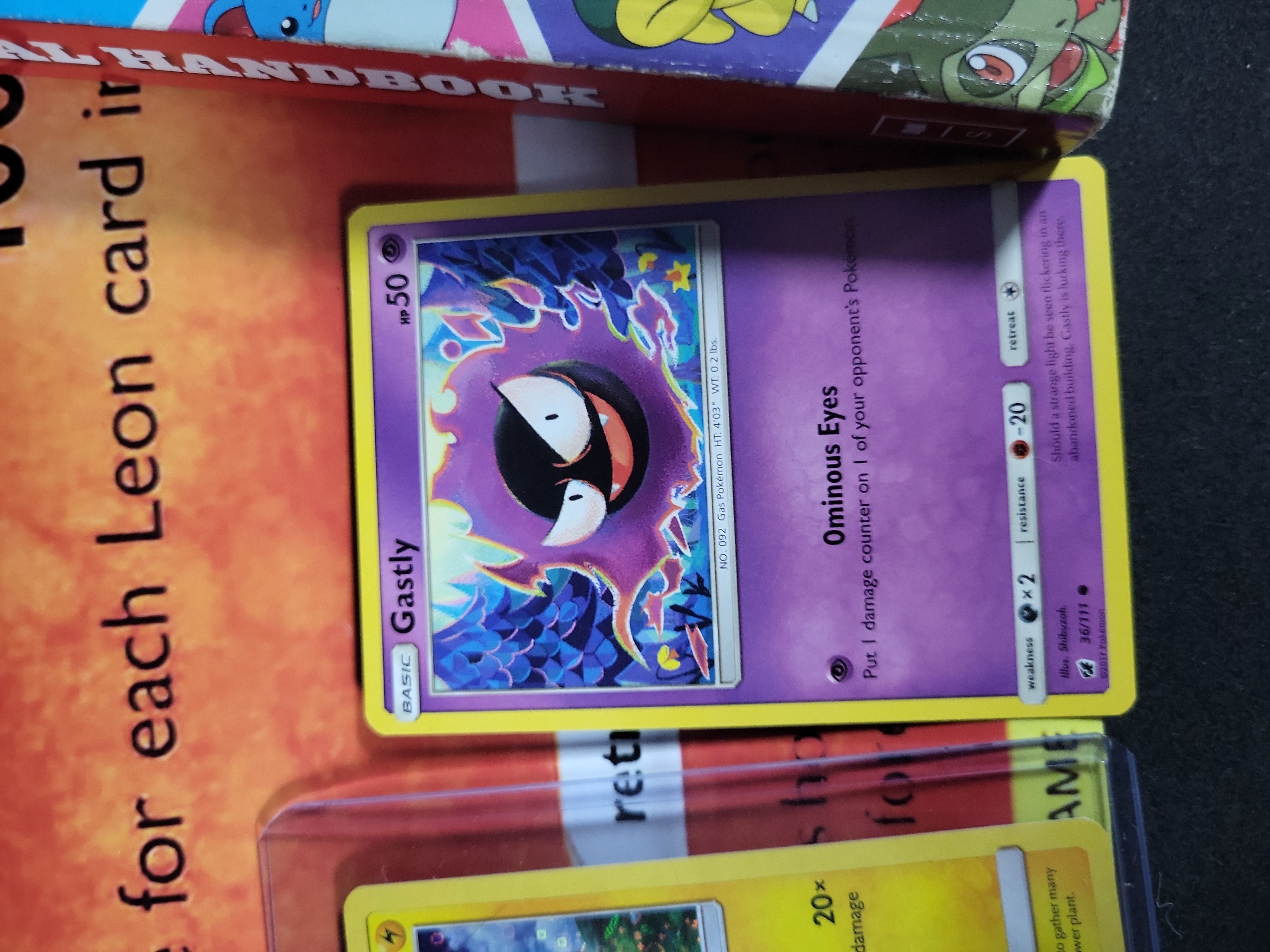 I02792 | A Collection of Pokémon Trading Cards and Collectibles Including 23K Gold-Plated Promotional Card and Handbooks
