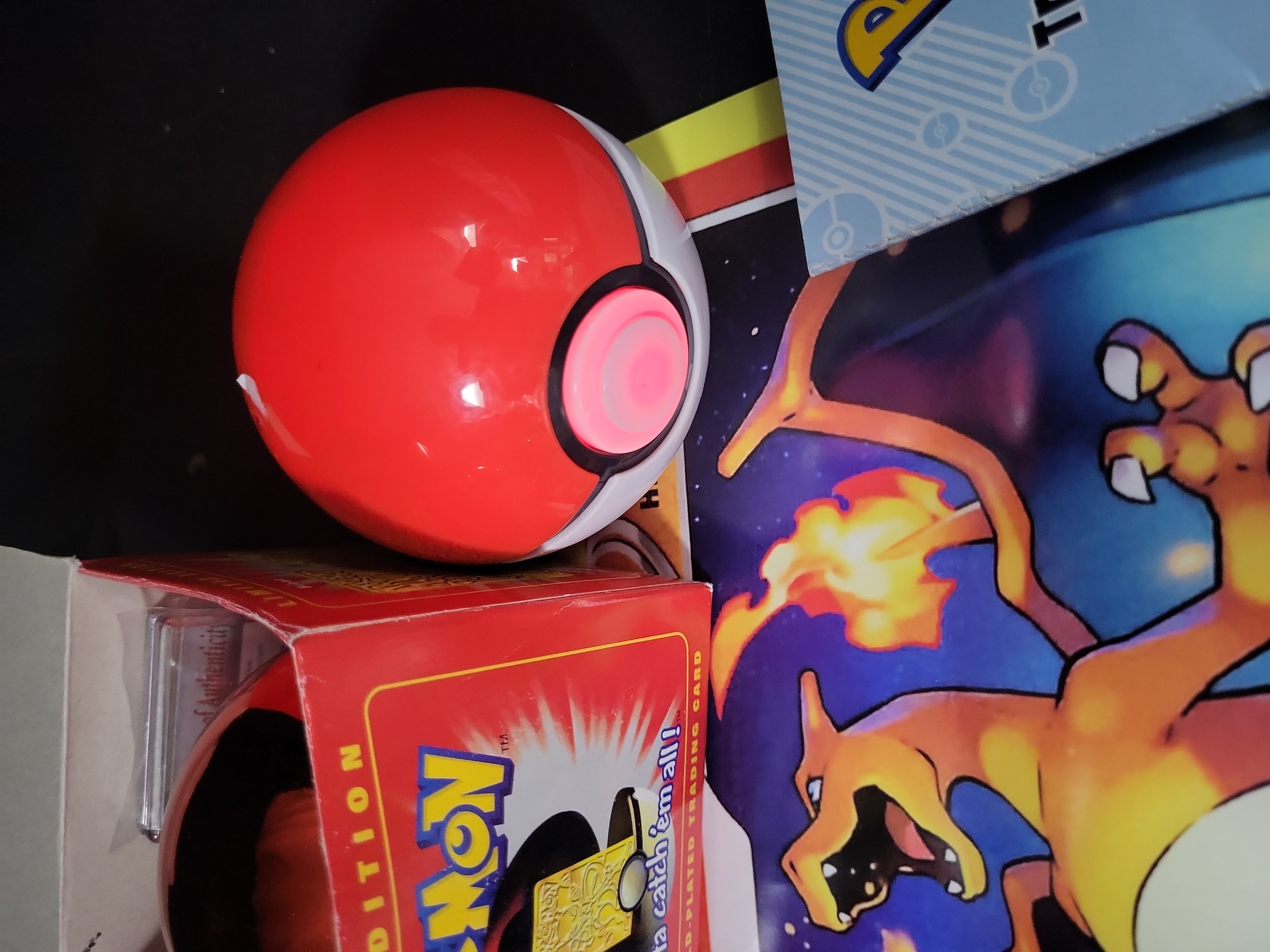 I02792 | A Collection of Pokémon Trading Cards and Collectibles Including 23K Gold-Plated Promotional Card and Handbooks