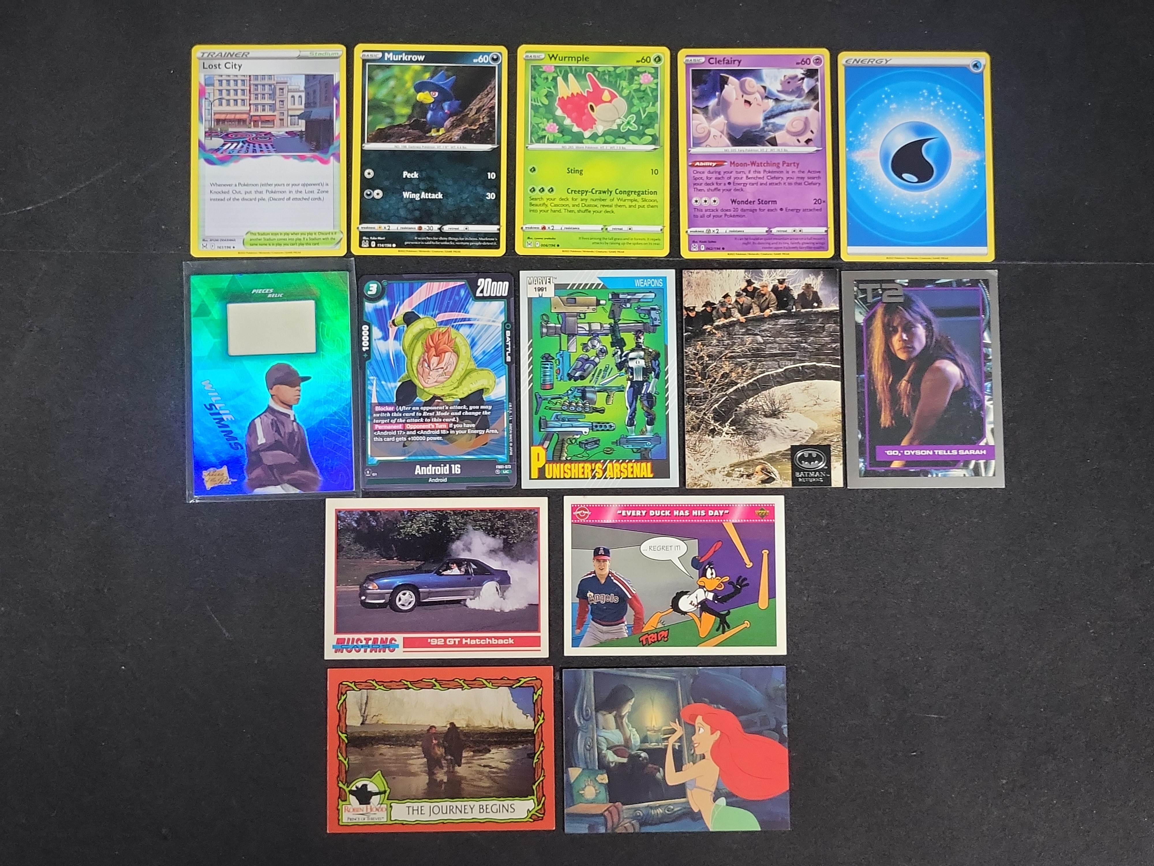 I03168 | An Assortment of 14 Trading and Collectible Cards Including Pokemon, Marvel, and Film Properties