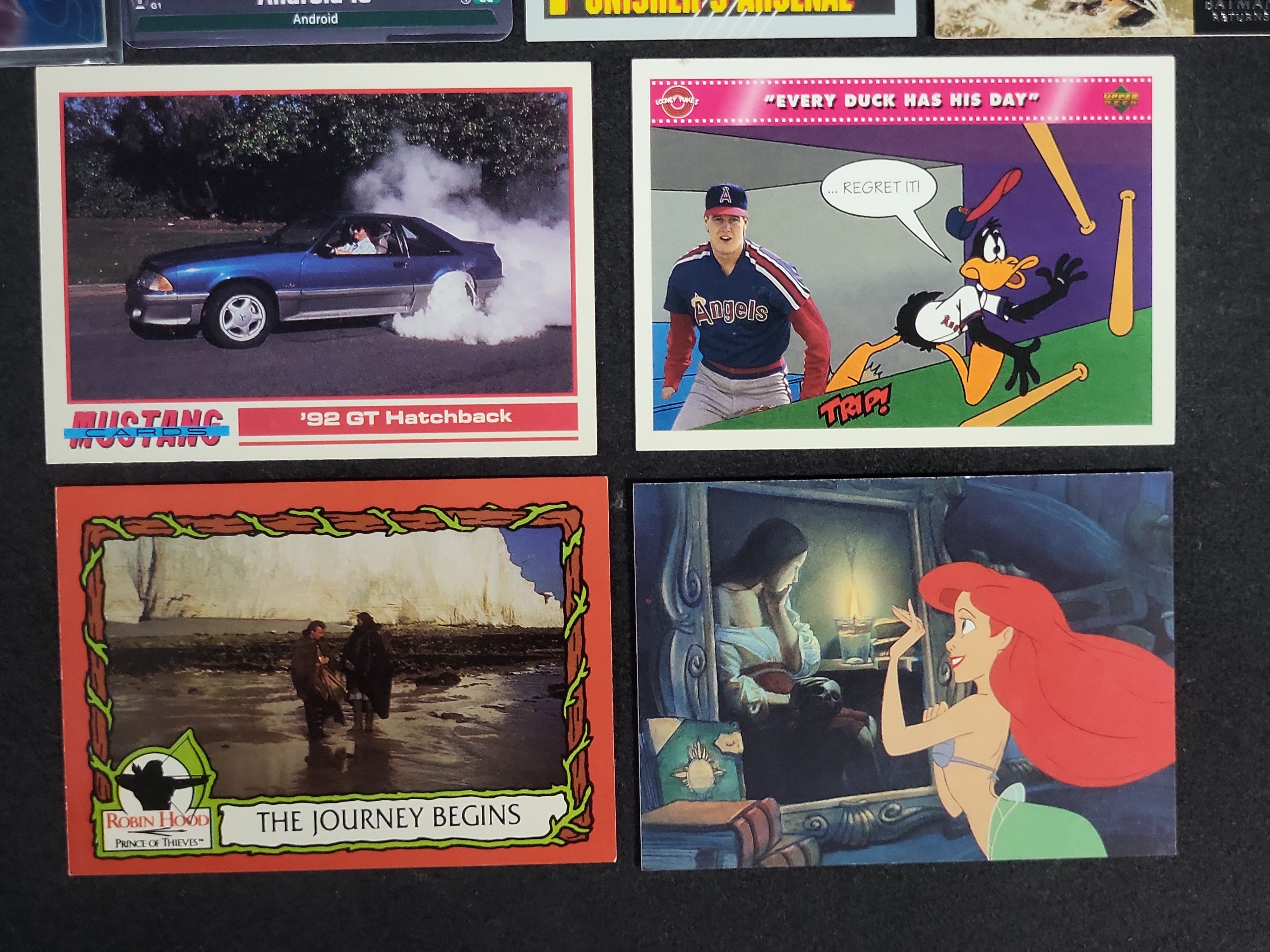 I03168 | An Assortment of 14 Trading and Collectible Cards Including Pokemon, Marvel, and Film Properties