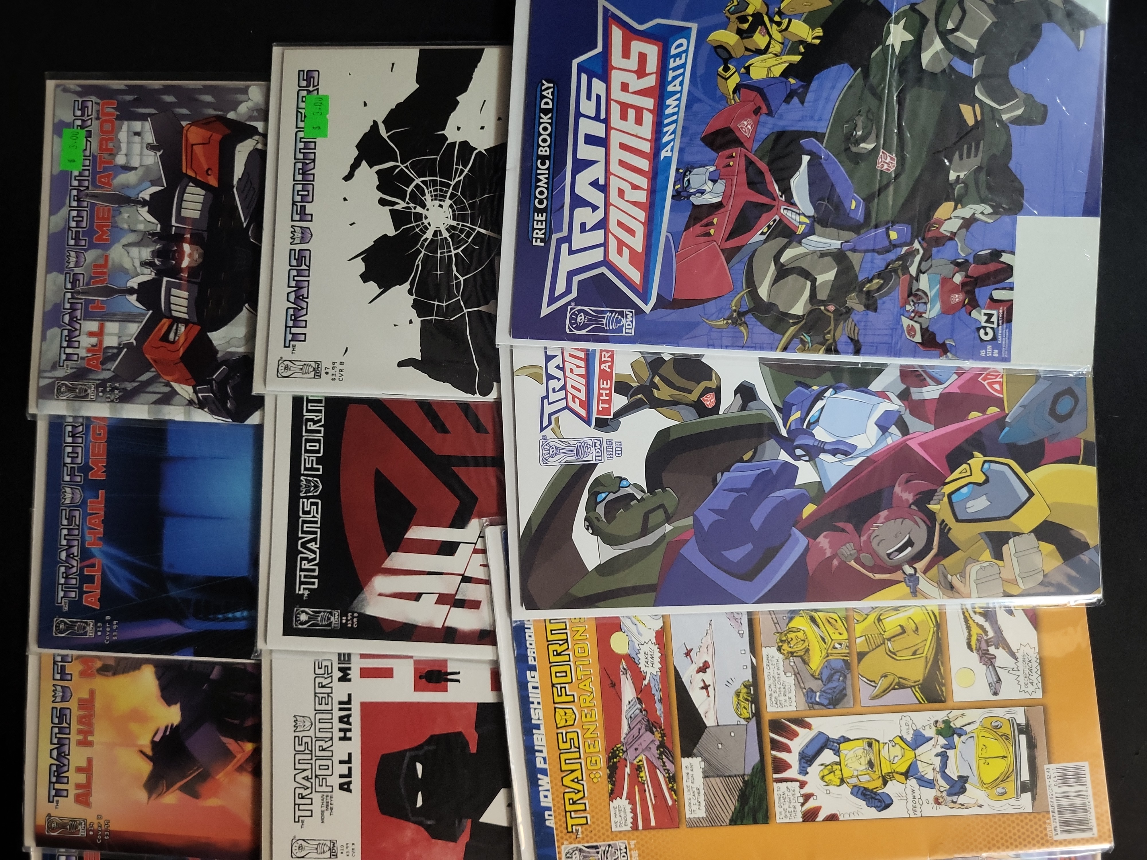 I03785 | A Collection of IDW Publishing Transformers Comic Books including All Hail Megatron and Movie Tie-ins