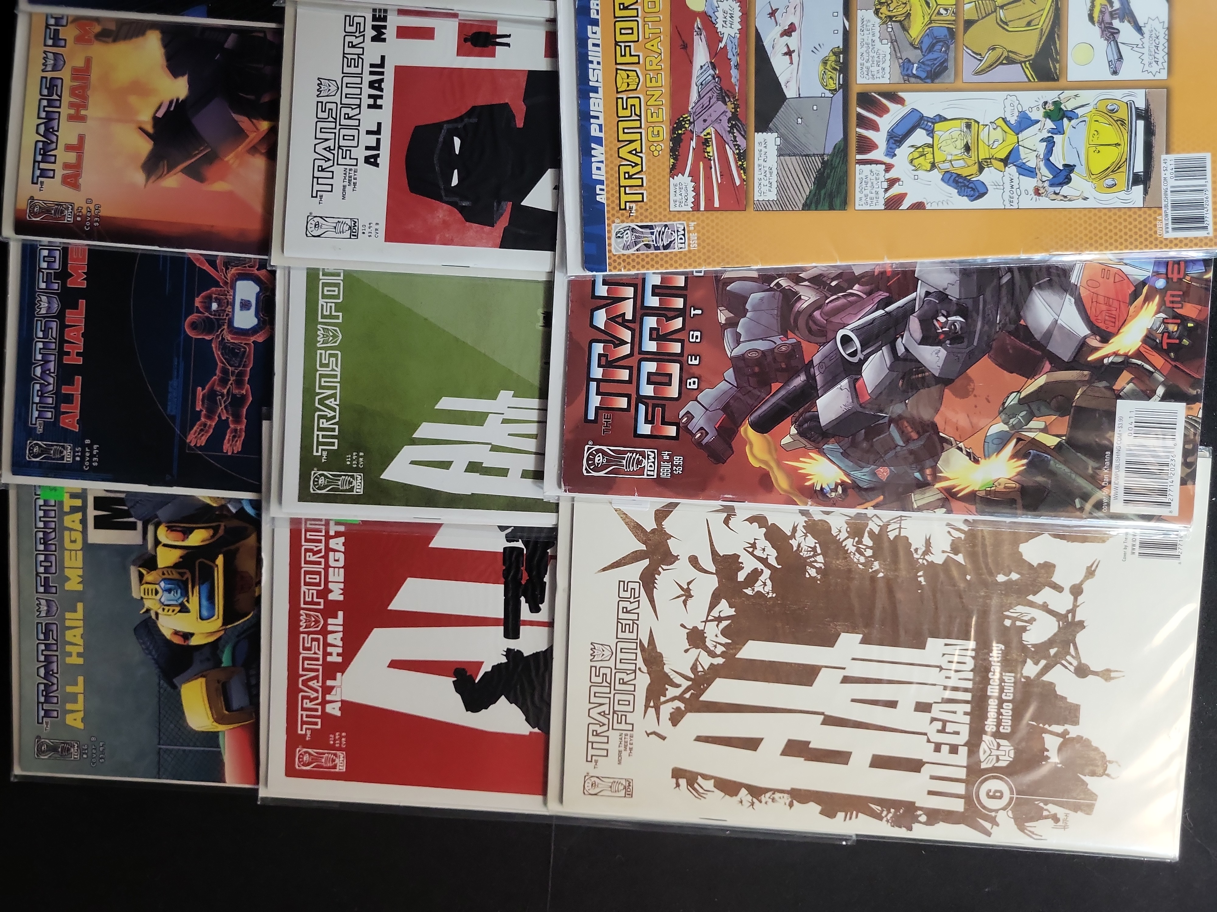 I03785 | A Collection of IDW Publishing Transformers Comic Books including All Hail Megatron and Movie Tie-ins