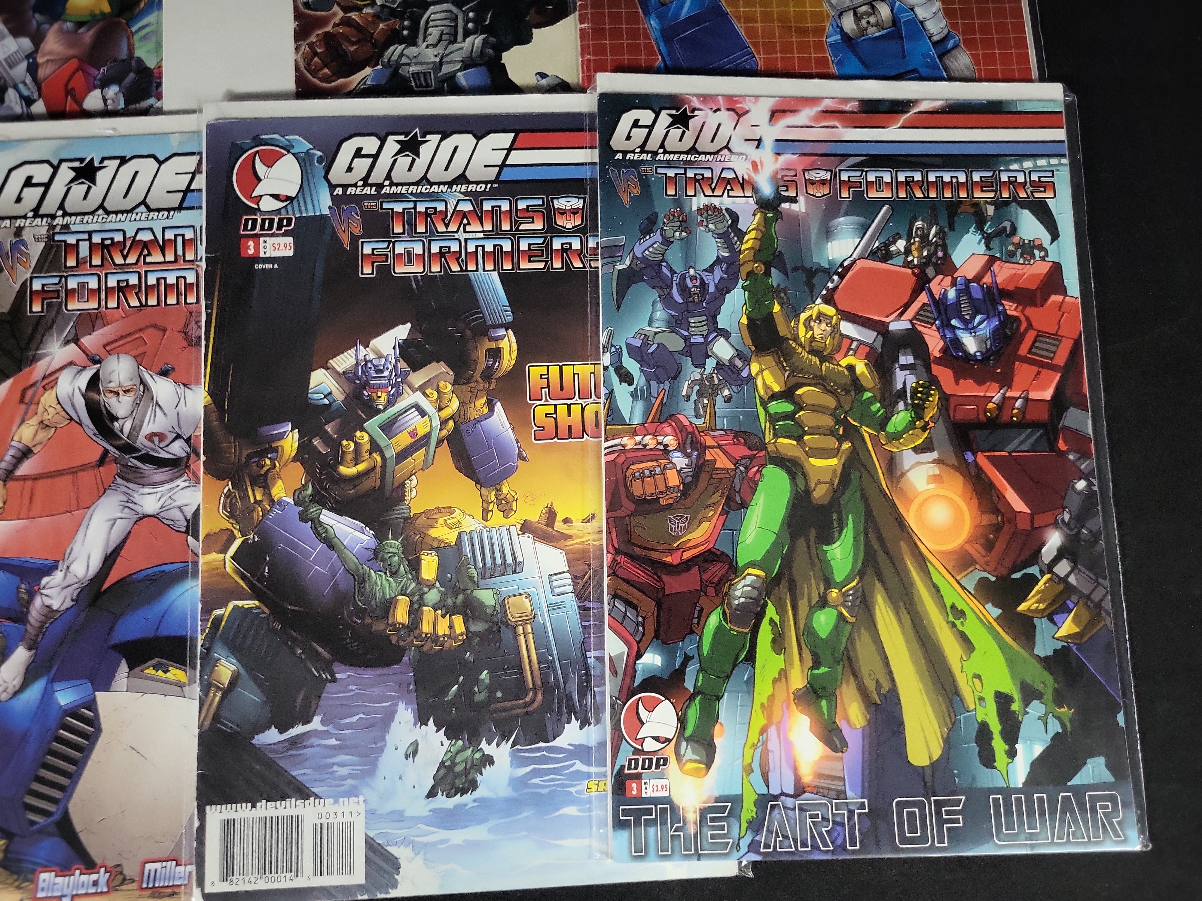 I03783 | A Collection of Transformers and G.I. Joe Crossover Comic Books and Convention Ephemera