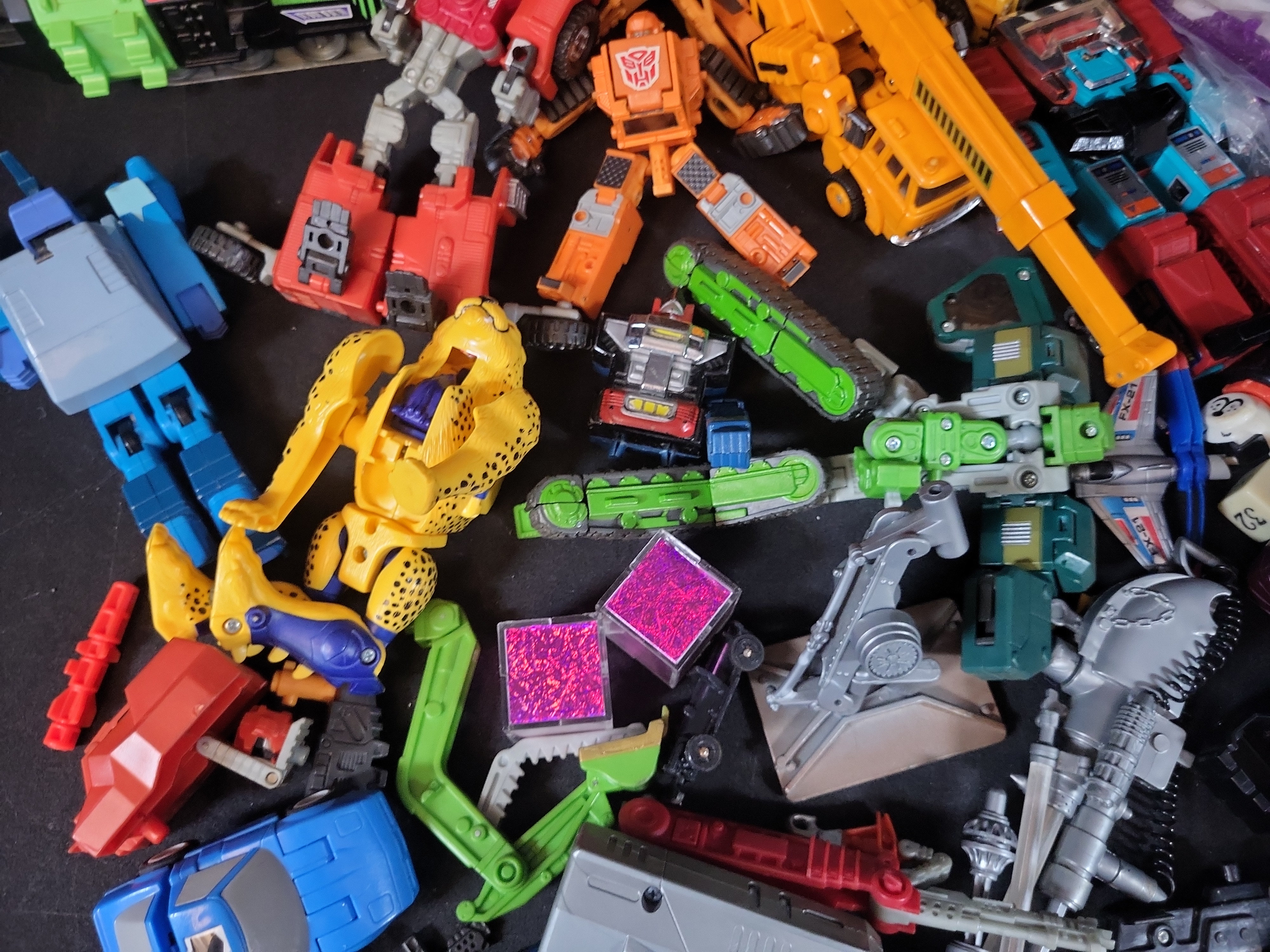 I03506 | A Collection of Vintage and Modern Hasbro and Takara Transformers Action Figures Accessories and Ephemera