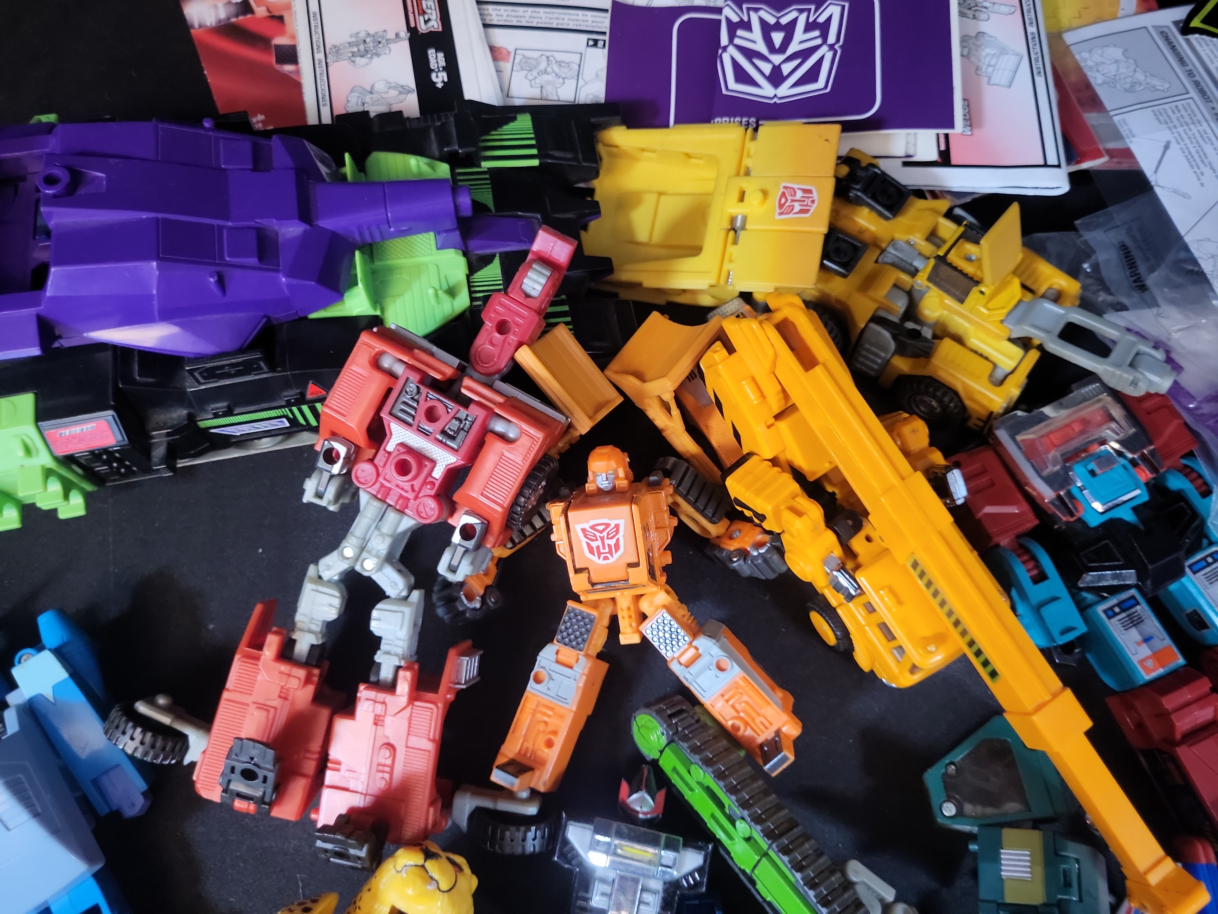 I03506 | A Collection of Vintage and Modern Hasbro and Takara Transformers Action Figures Accessories and Ephemera