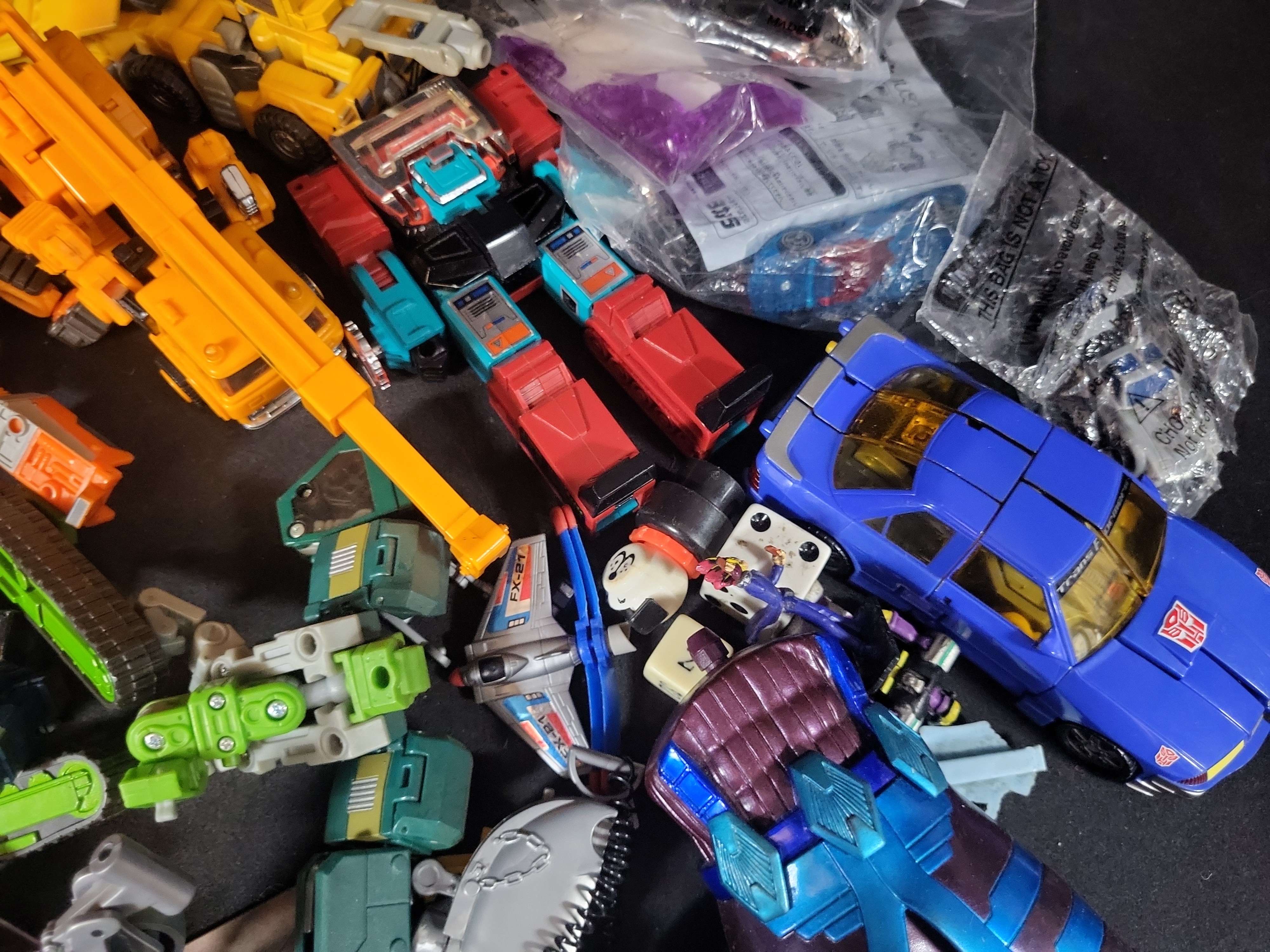 I03506 | A Collection of Vintage and Modern Hasbro and Takara Transformers Action Figures Accessories and Ephemera