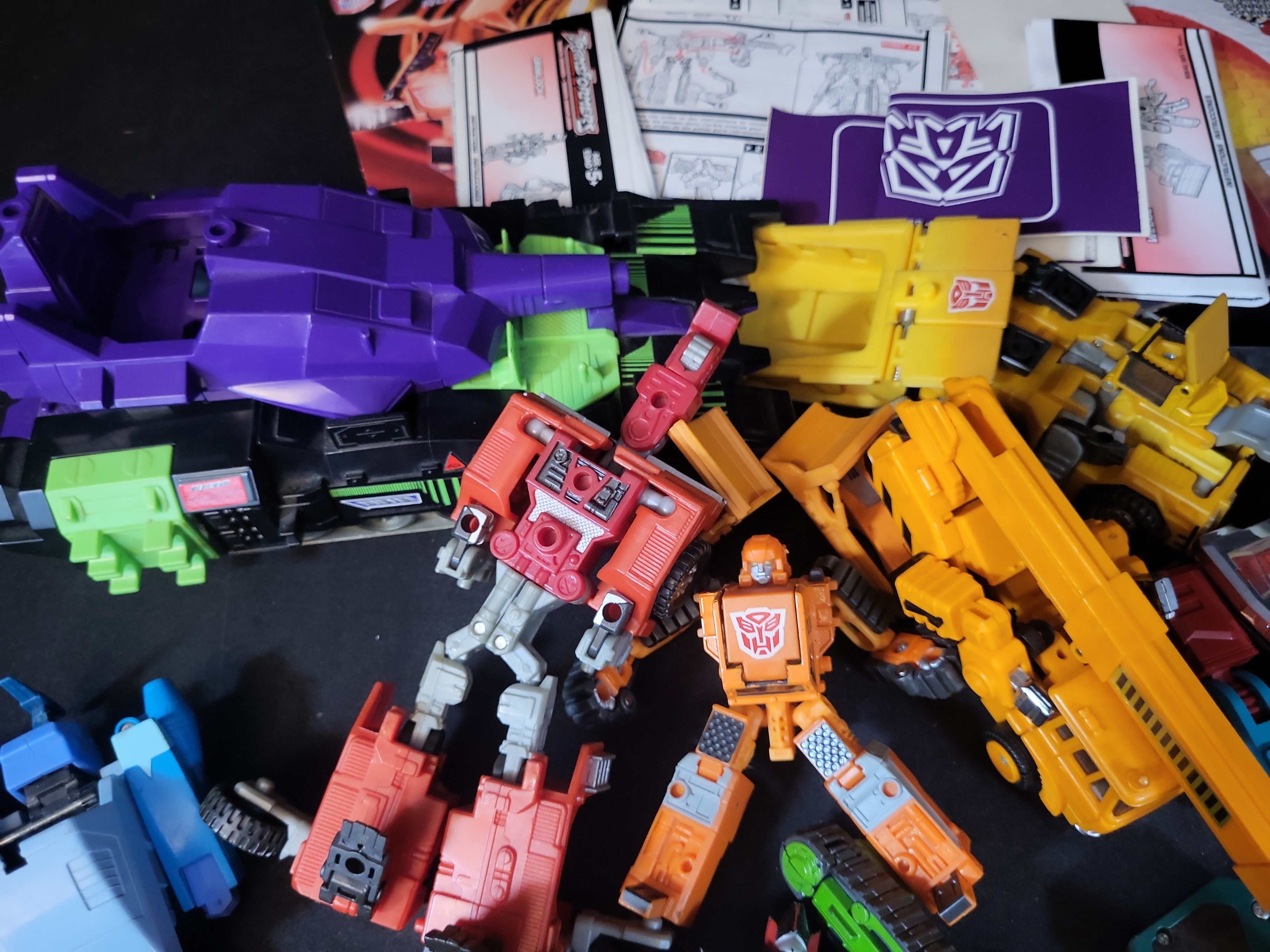 I03506 | A Collection of Vintage and Modern Hasbro and Takara Transformers Action Figures Accessories and Ephemera