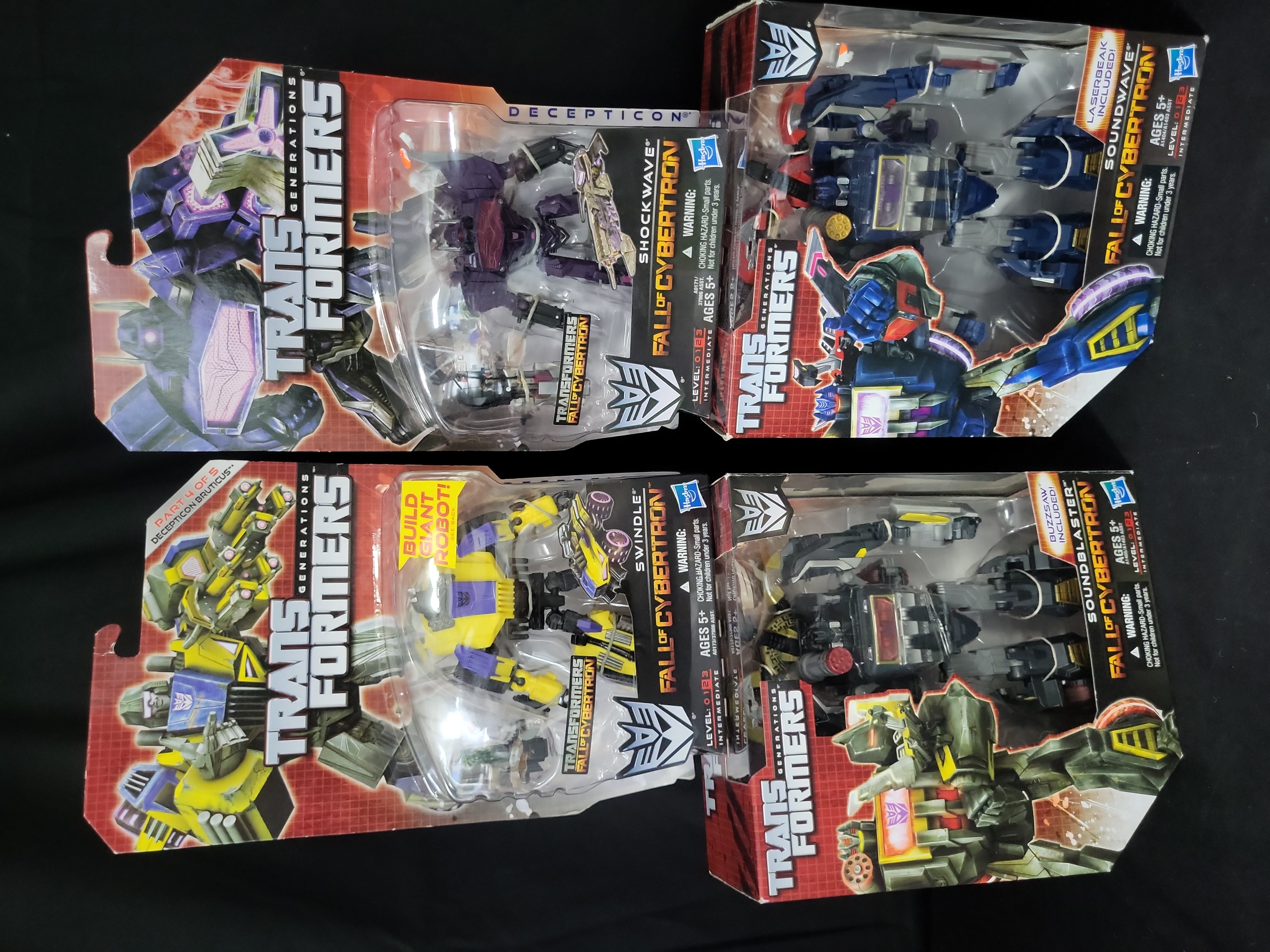 I03524 | A Set of Four Hasbro Transformers Generations Fall of Cybertron Action Figures