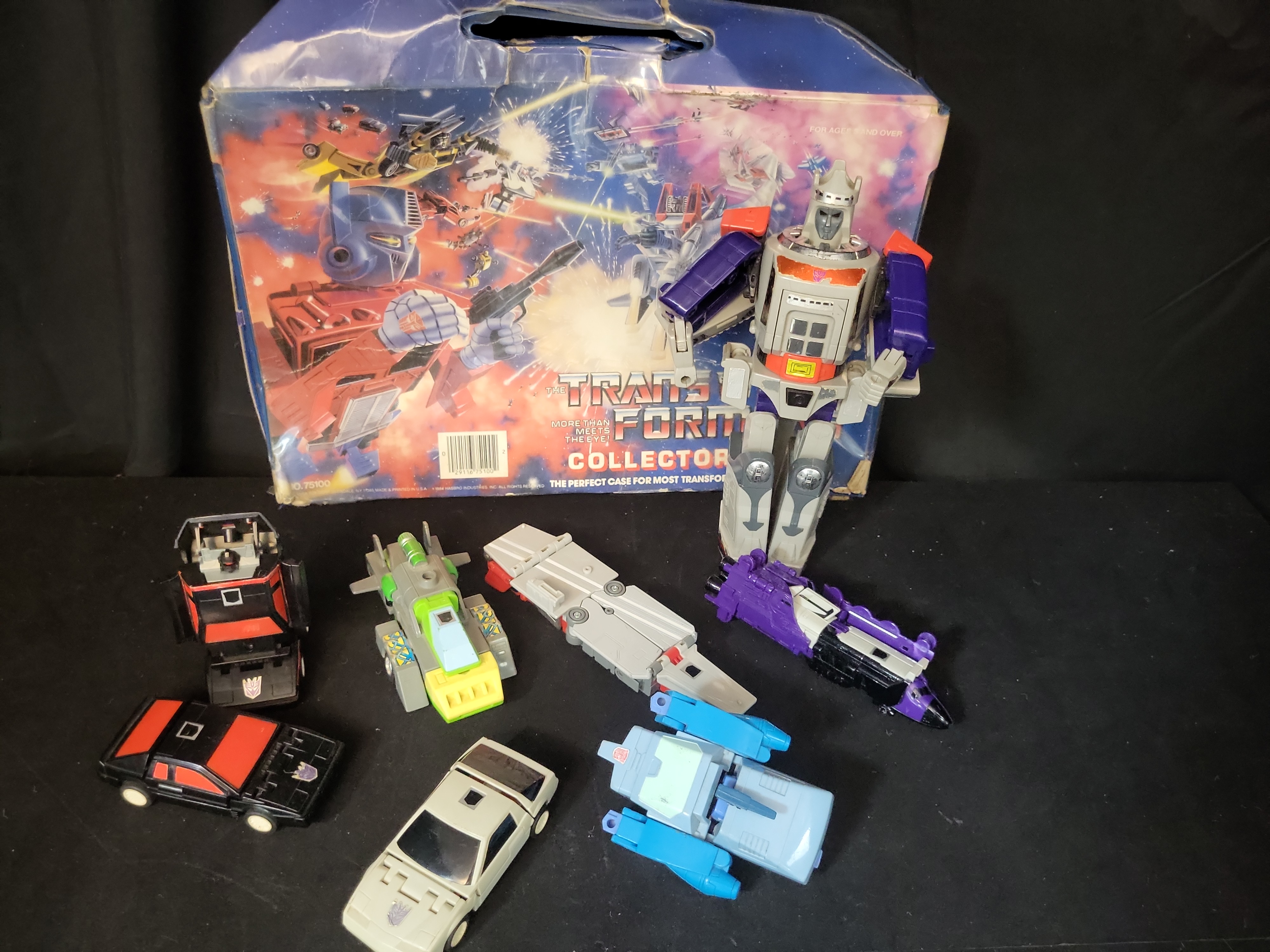 I03507 | A Collection of Vintage Hasbro G1 Transformers Action Figures and 1984 Tara Toy Collectors Case