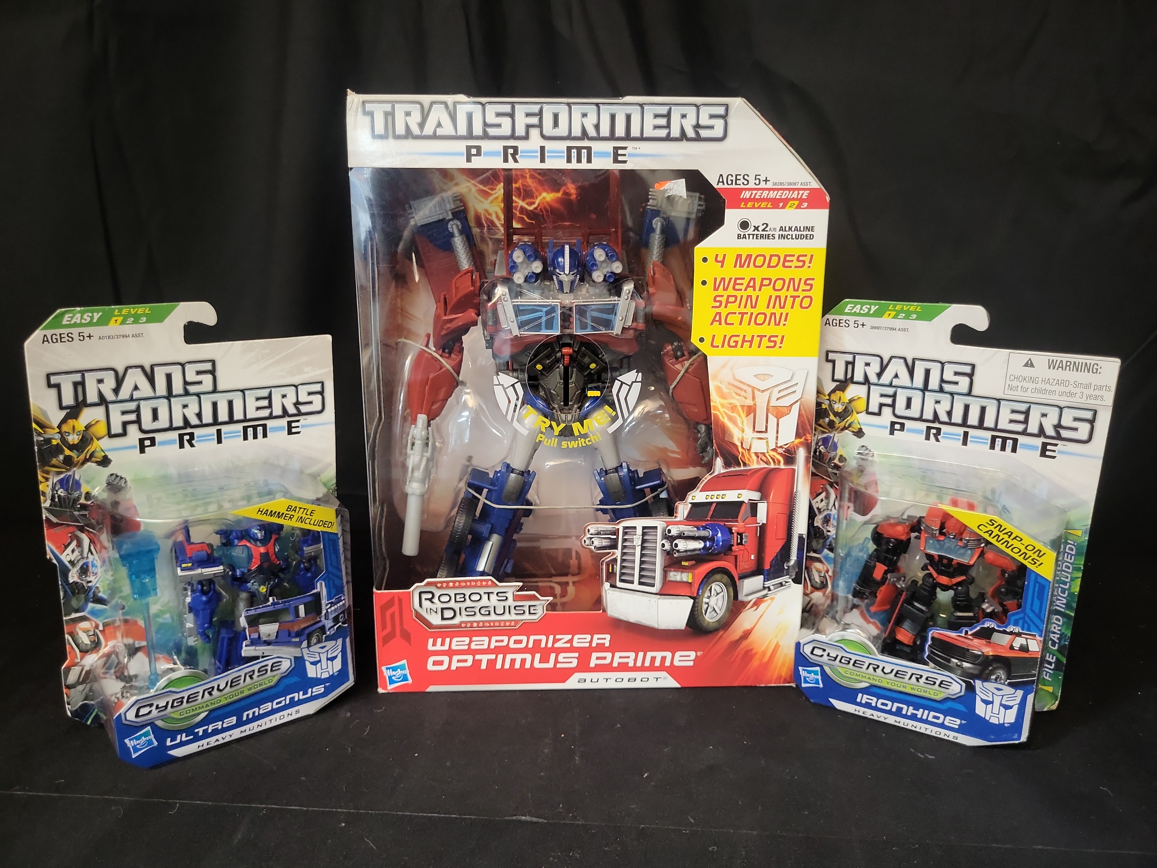 I03518 | A Trio of Hasbro Transformers Prime Action Figures including Weaponizer Optimus Prime