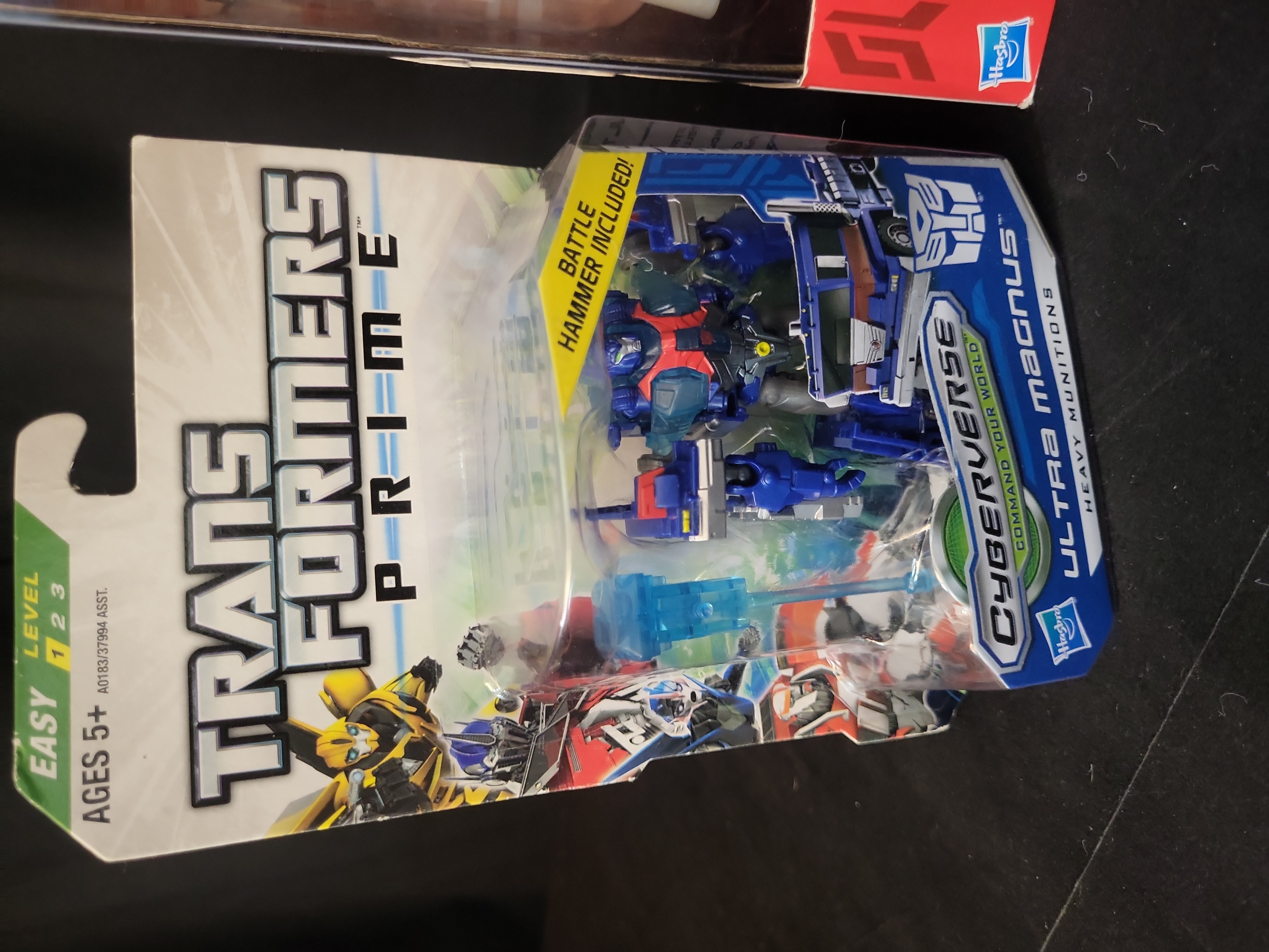 I03518 | A Trio of Hasbro Transformers Prime Action Figures including Weaponizer Optimus Prime