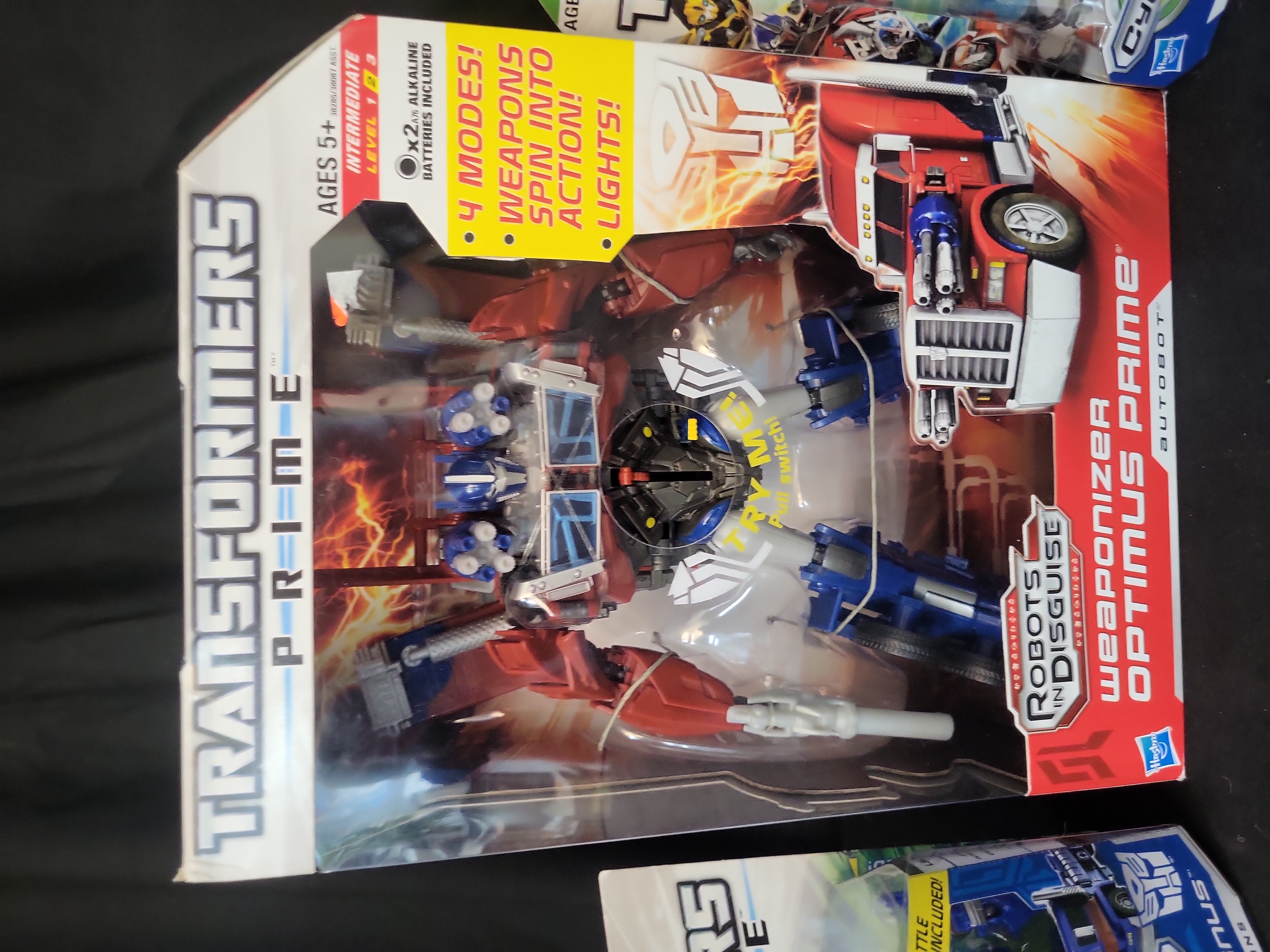 I03518 | A Trio of Hasbro Transformers Prime Action Figures including Weaponizer Optimus Prime