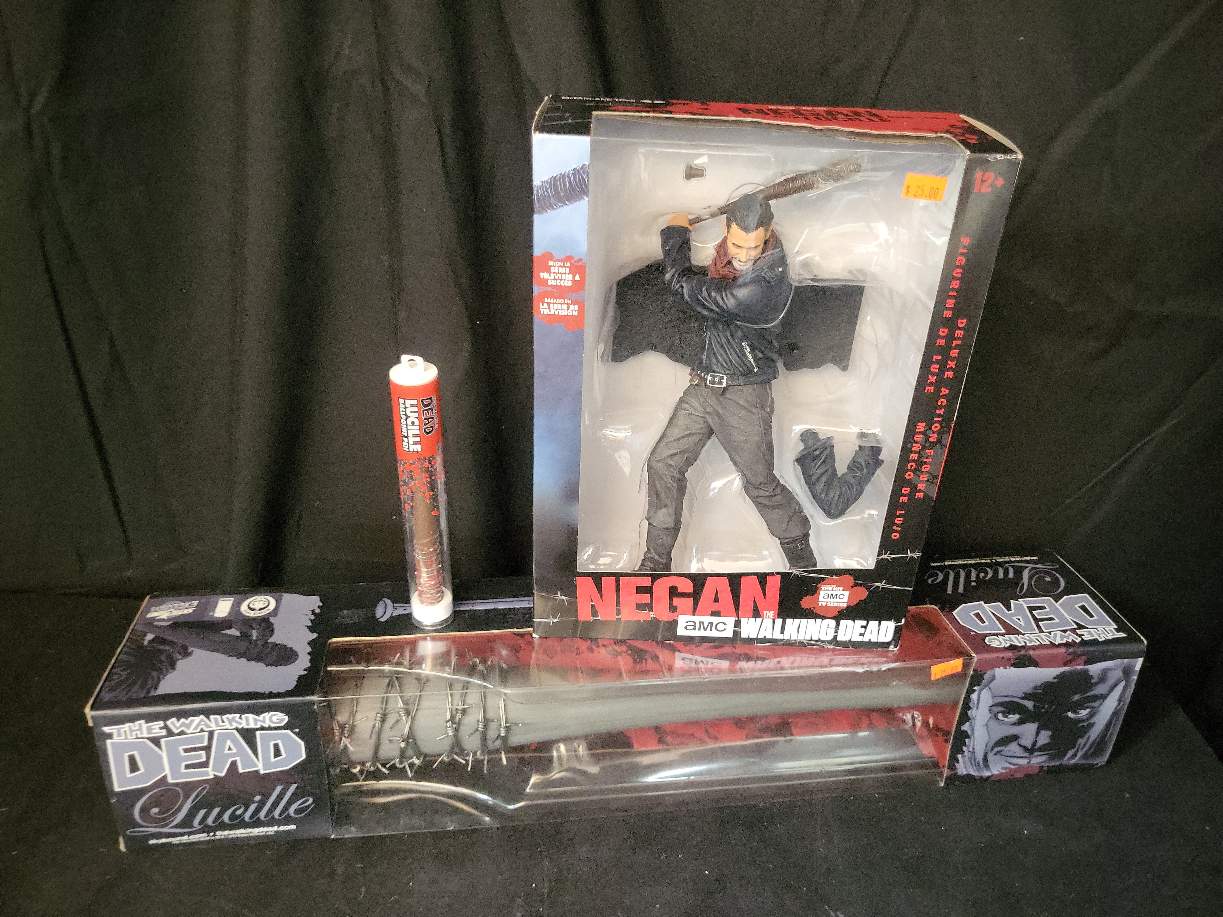 I03517 | Three The Walking Dead Negan Collectibles Including McFarlane Action Figure and Lucille Prop Replicas
