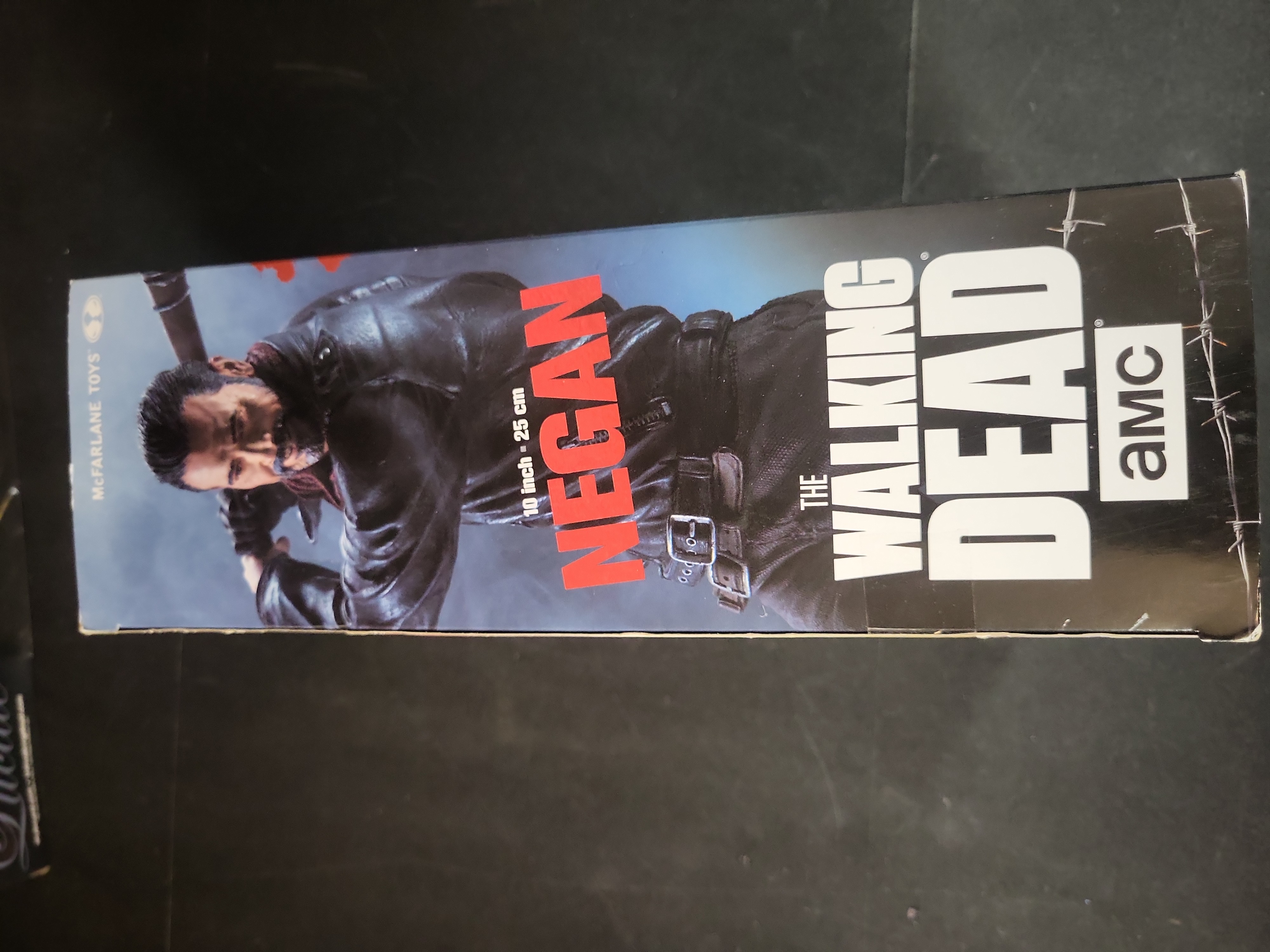 I03517 | Three The Walking Dead Negan Collectibles Including McFarlane Action Figure and Lucille Prop Replicas