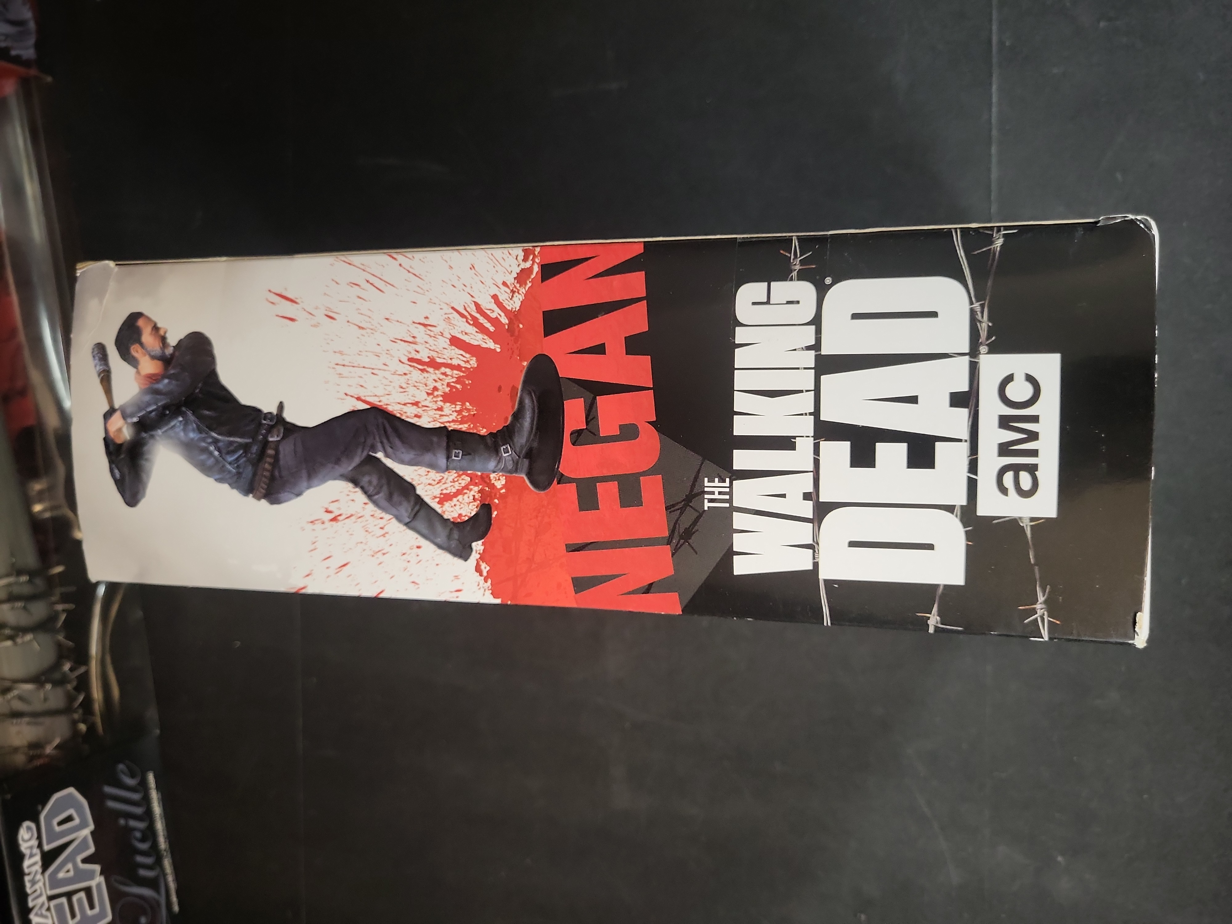 I03517 | Three The Walking Dead Negan Collectibles Including McFarlane Action Figure and Lucille Prop Replicas