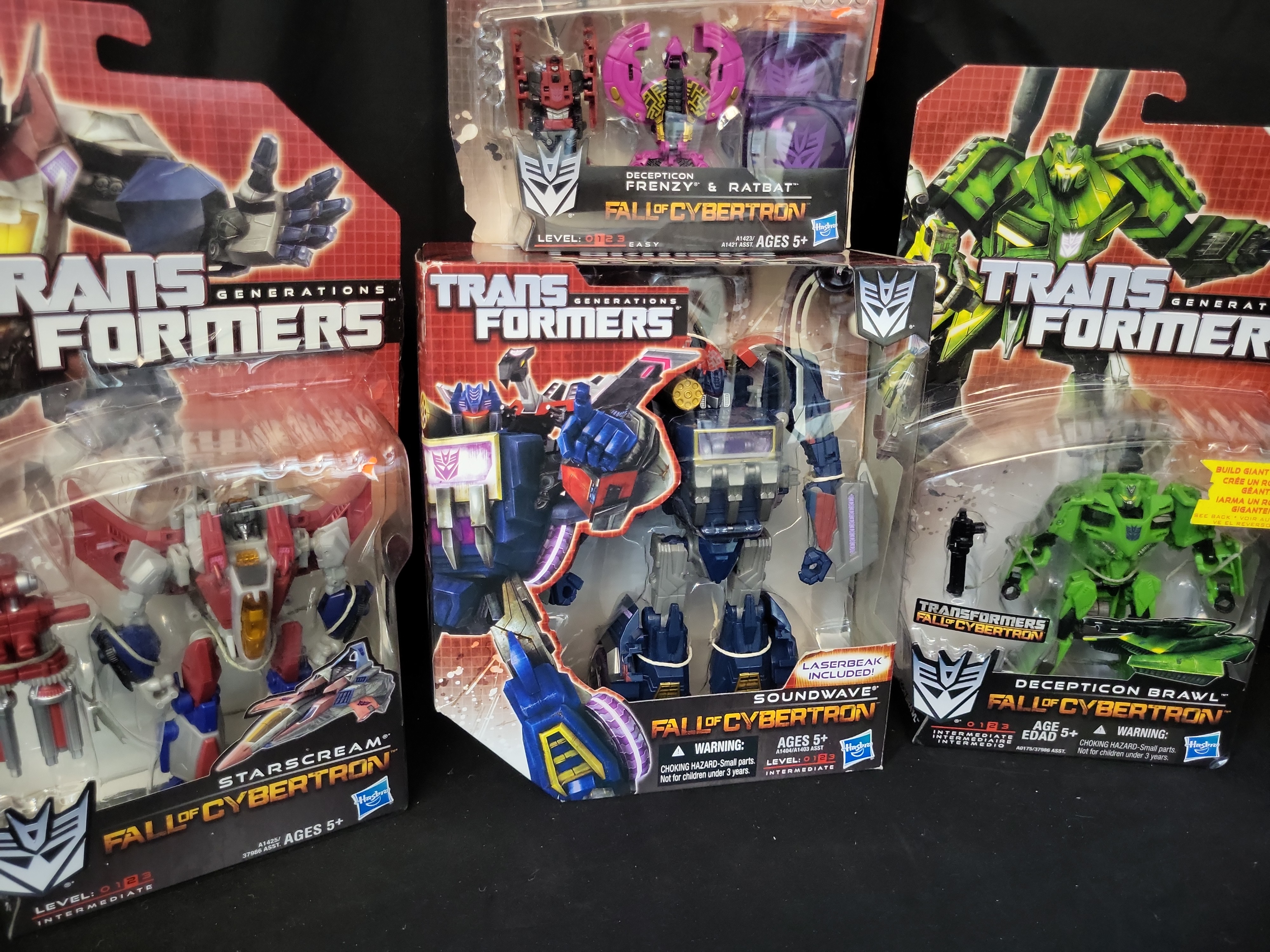 I03509 | Four Hasbro Transformers Generations Fall of Cybertron Series Action Figures