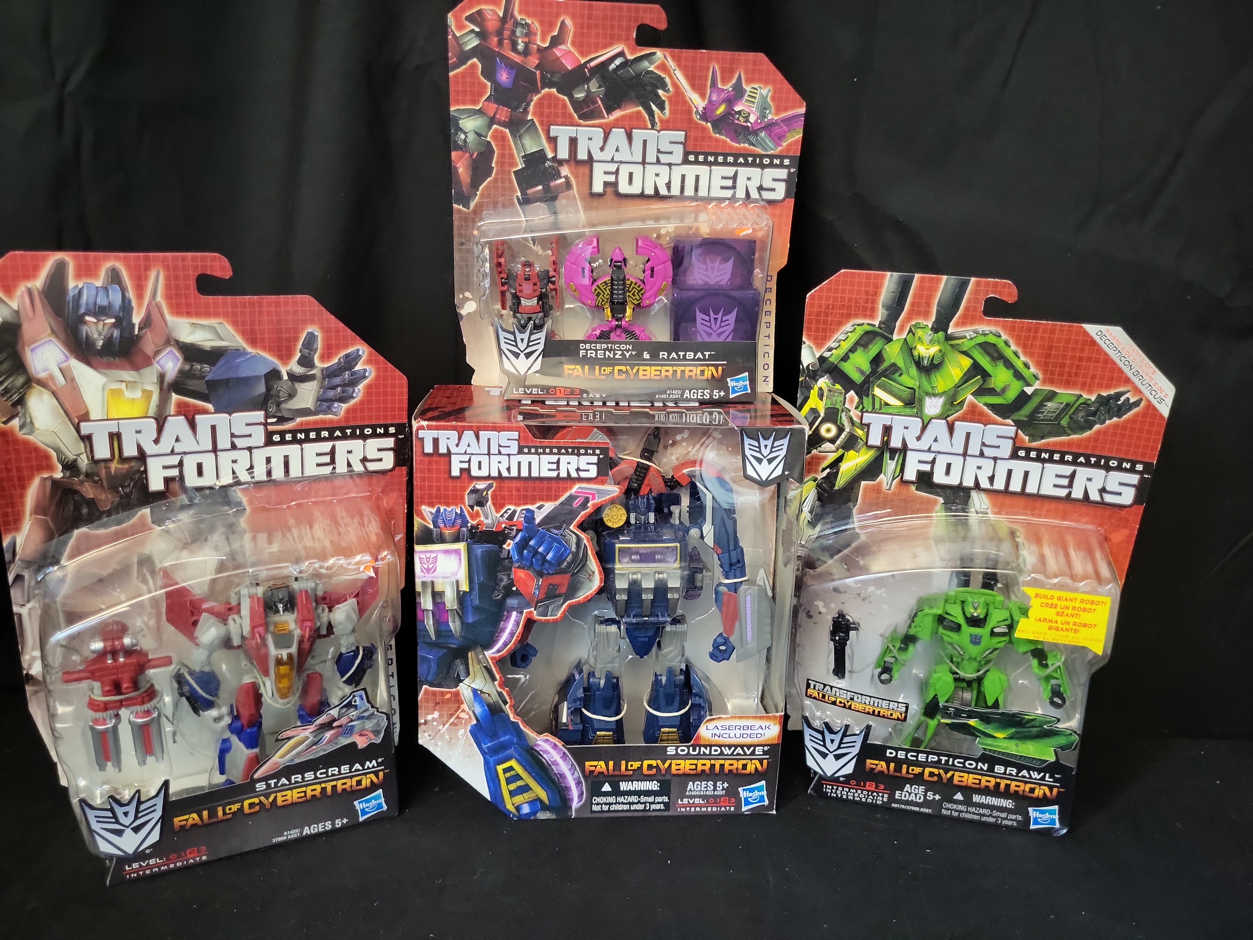 I03509 | Four Hasbro Transformers Generations Fall of Cybertron Series Action Figures