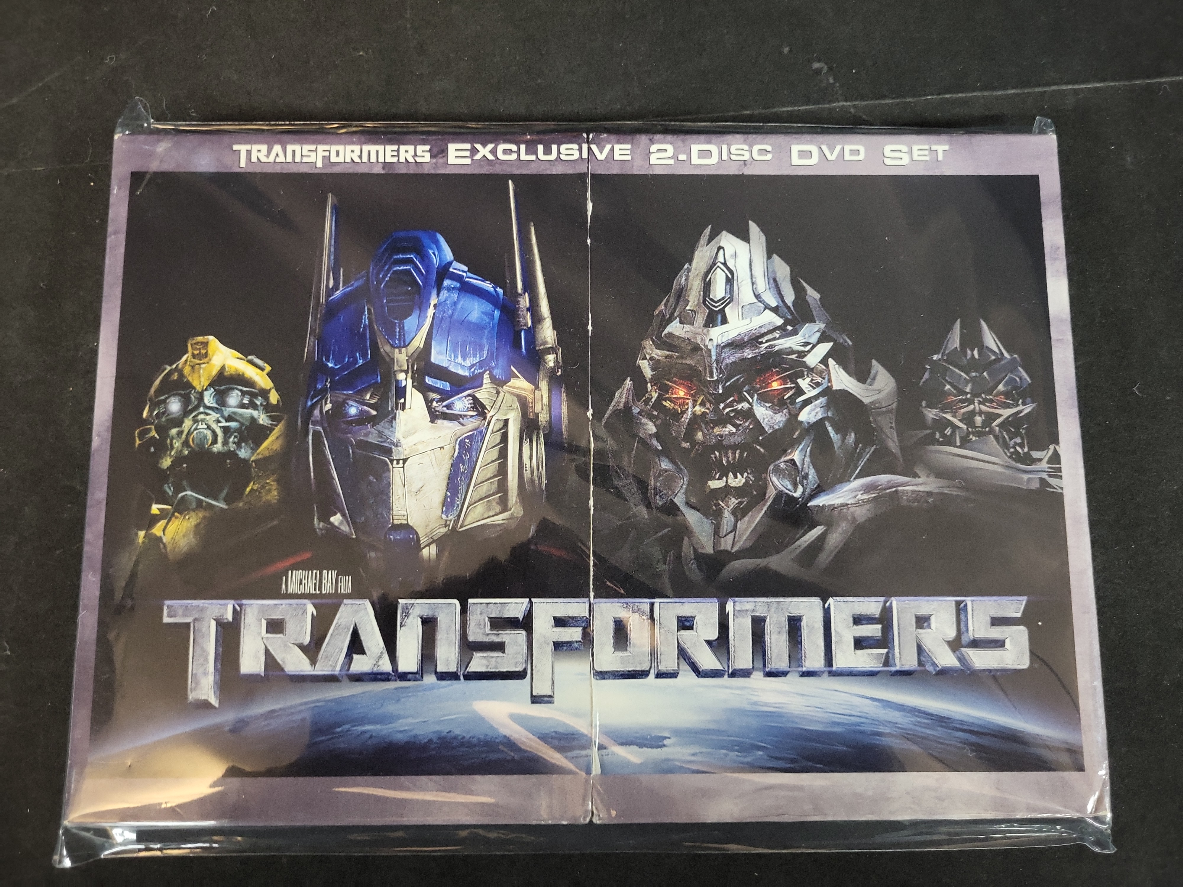 I03514 | A Collection of Transformers Action Figures and a DVD Set