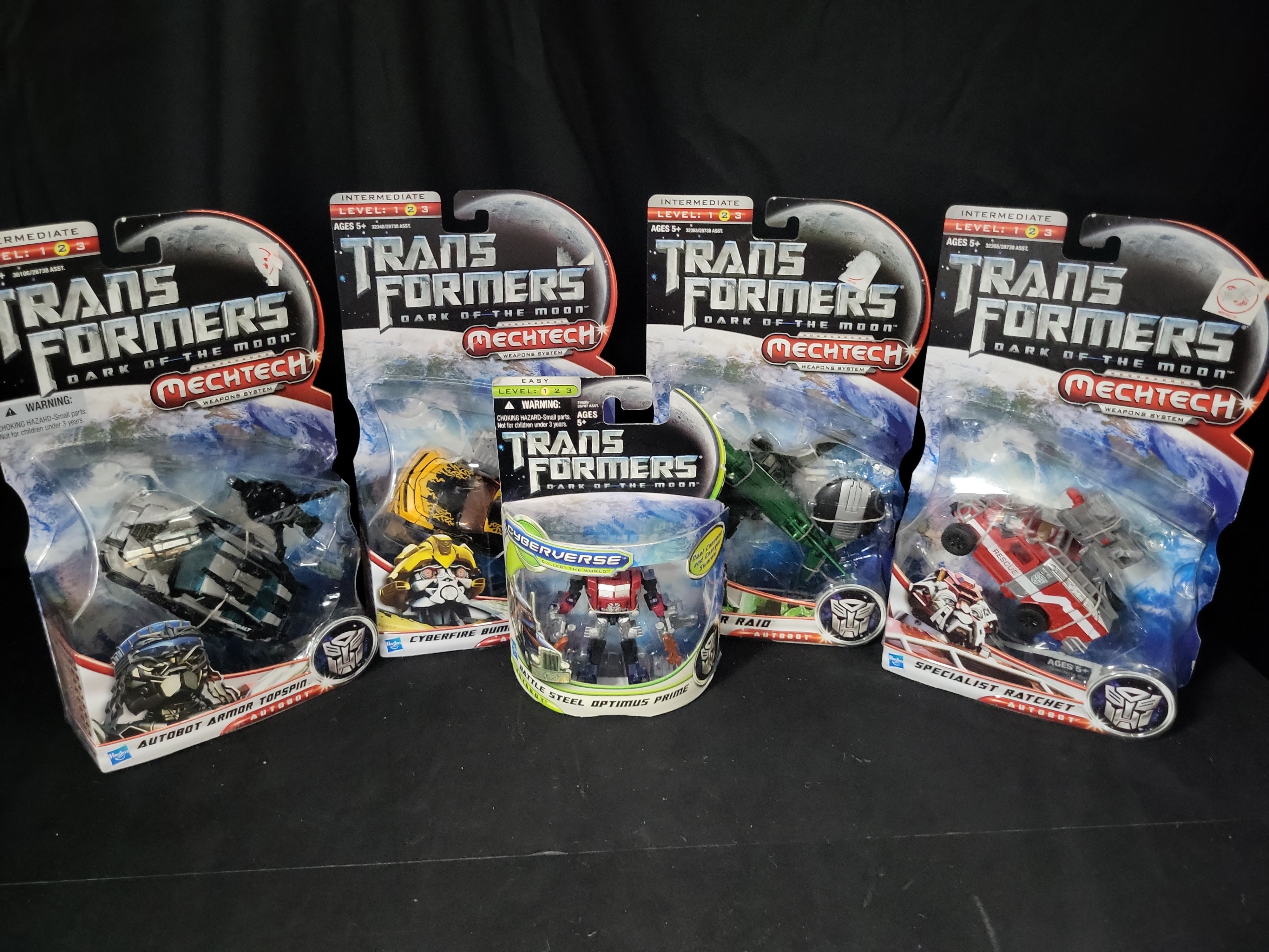 I03548 | A Collection of Five Hasbro Transformers Dark of the Moon Factory Sealed Action Figures