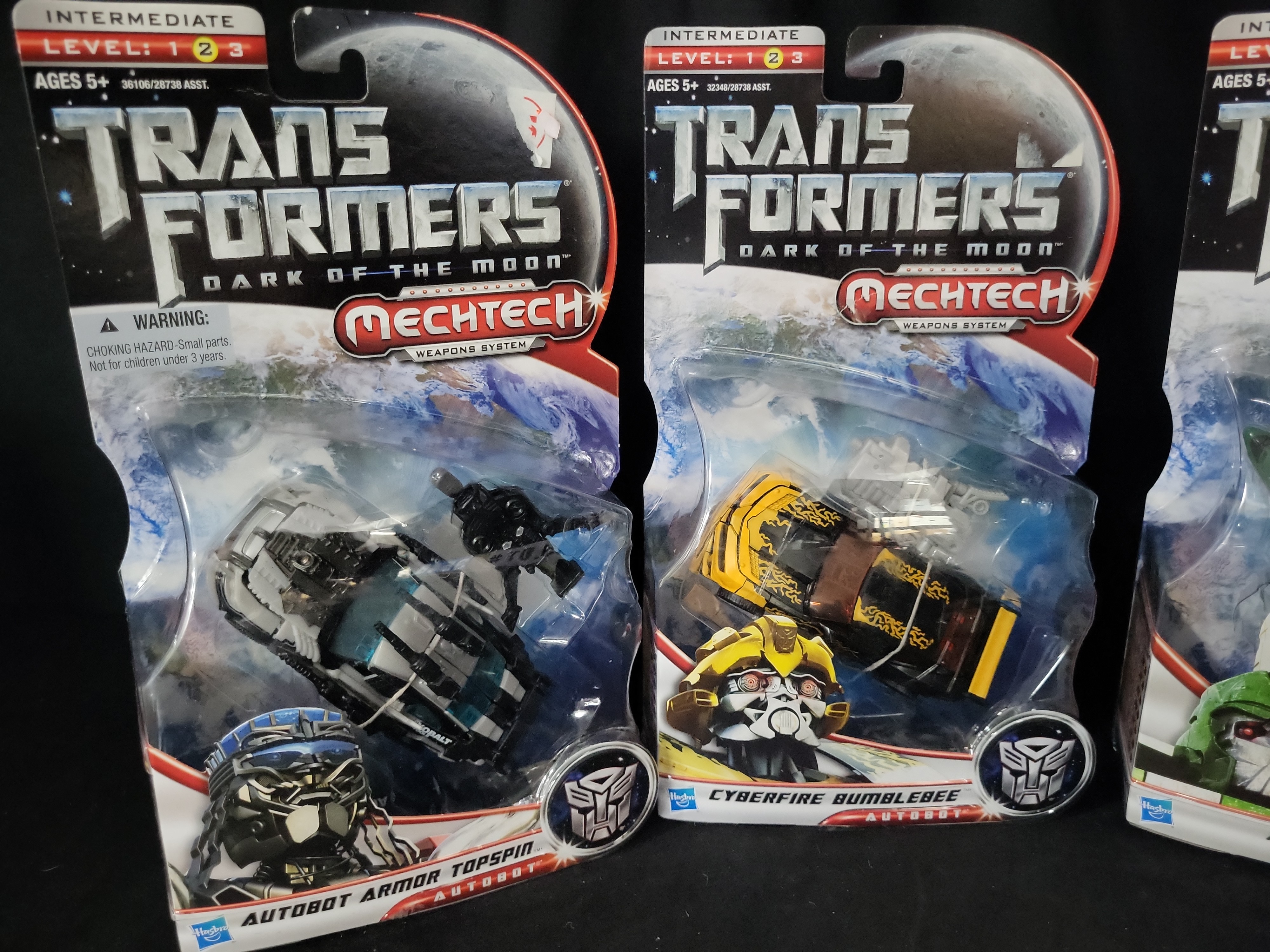 I03548 | A Collection of Five Hasbro Transformers Dark of the Moon Factory Sealed Action Figures