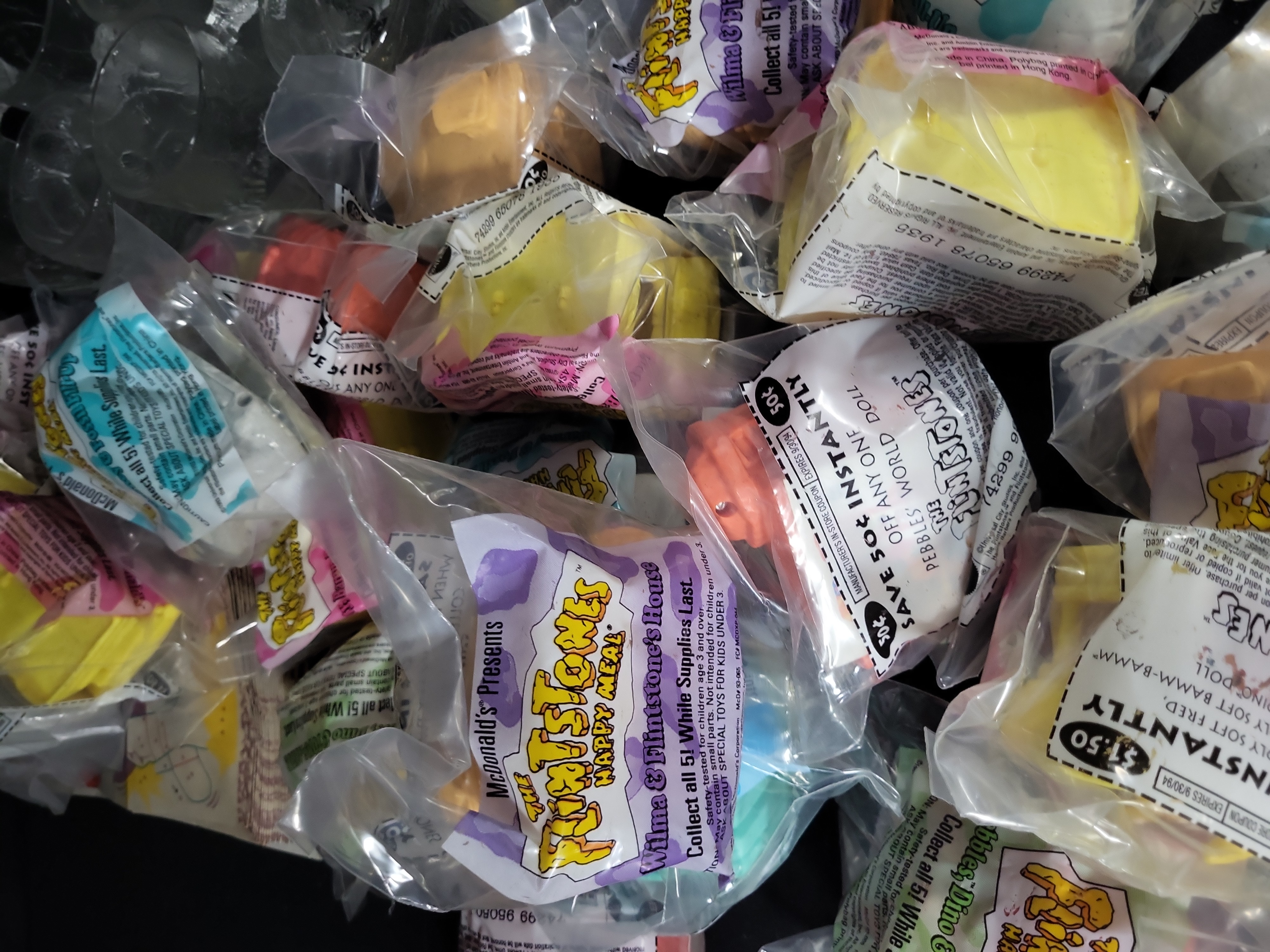 I03176 | A Collection of McDonald's RocDonald's Flintstones Promotional Mugs and Sealed Happy Meal Toys