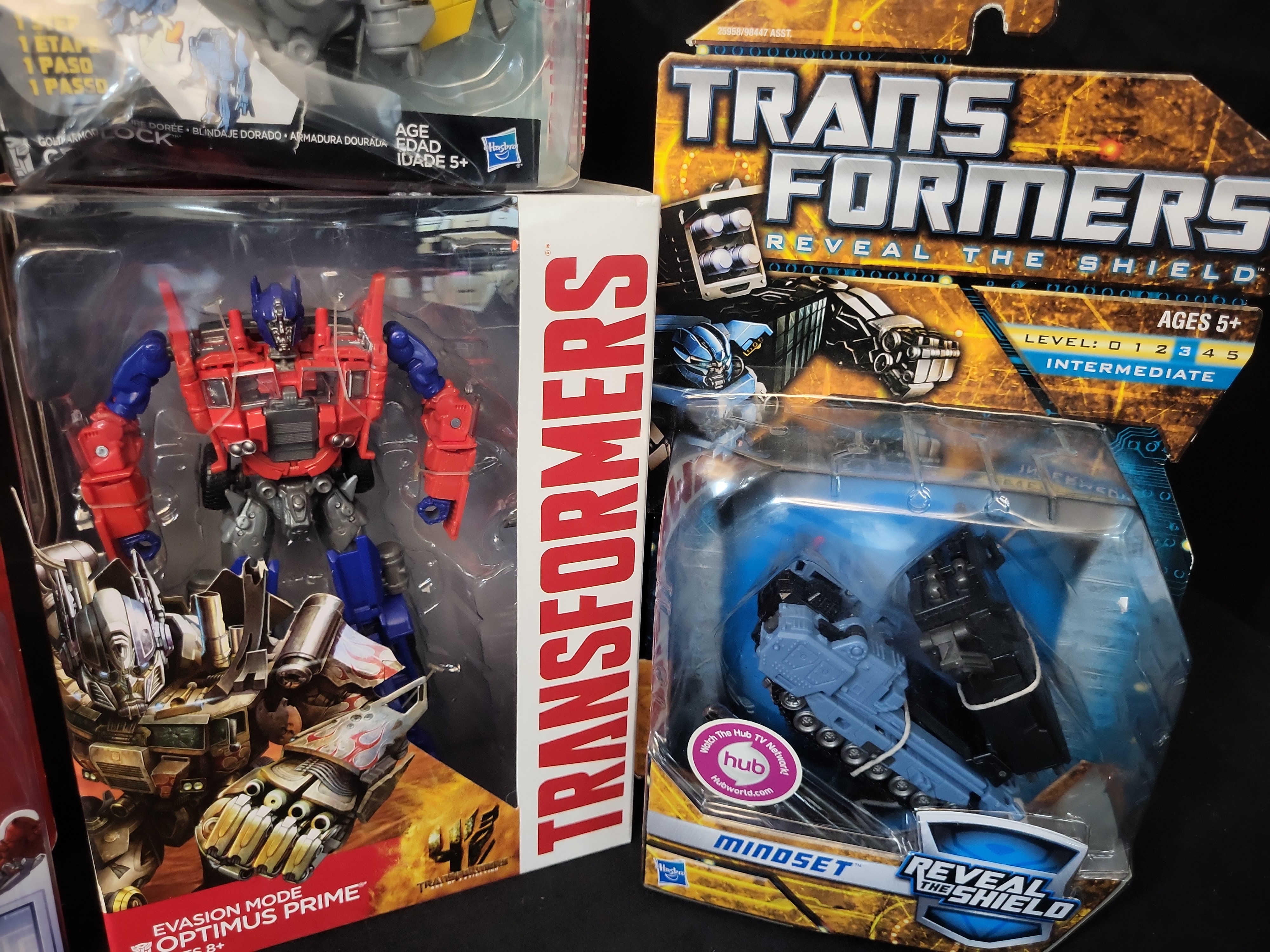 I03505 | Four Hasbro Transformers Action Figures Including Optimus Prime Arcee Mindset and Grimlock in Original Retail Packaging