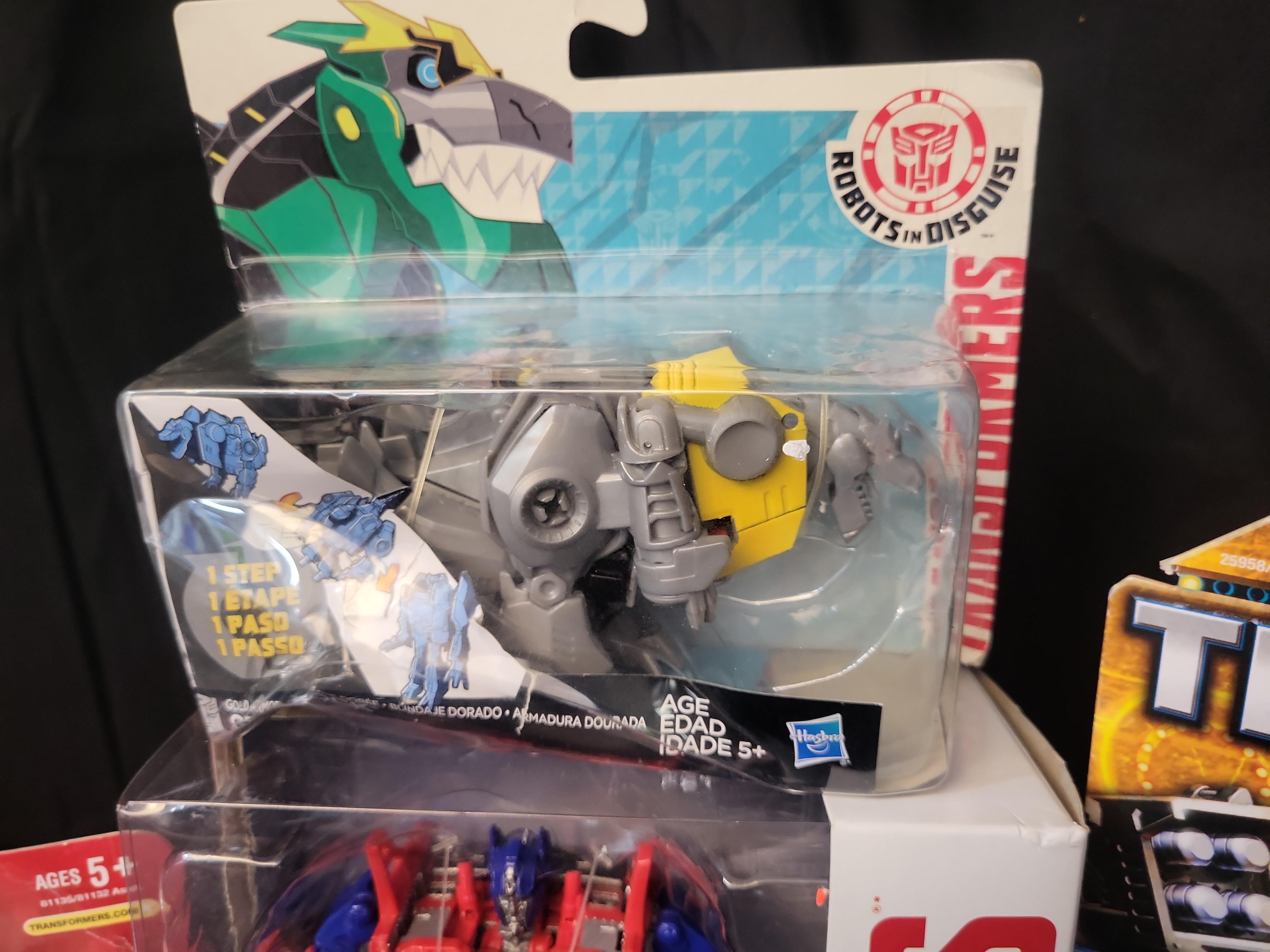 I03505 | Four Hasbro Transformers Action Figures Including Optimus Prime Arcee Mindset and Grimlock in Original Retail Packaging