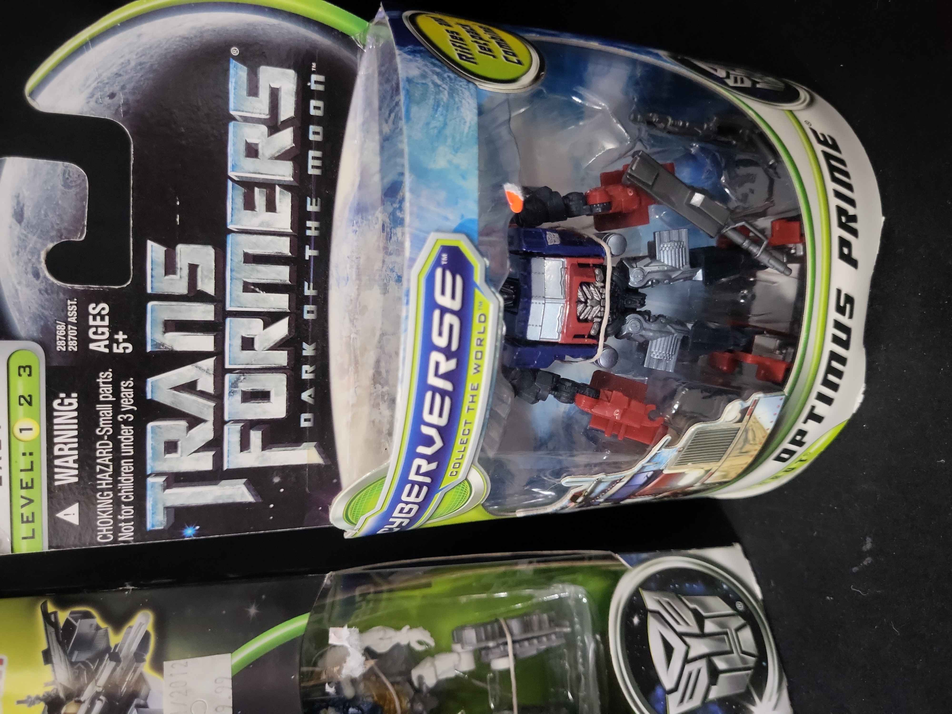 I03536 | A Pair of Hasbro Transformers Dark of the Moon Cyberverse Items