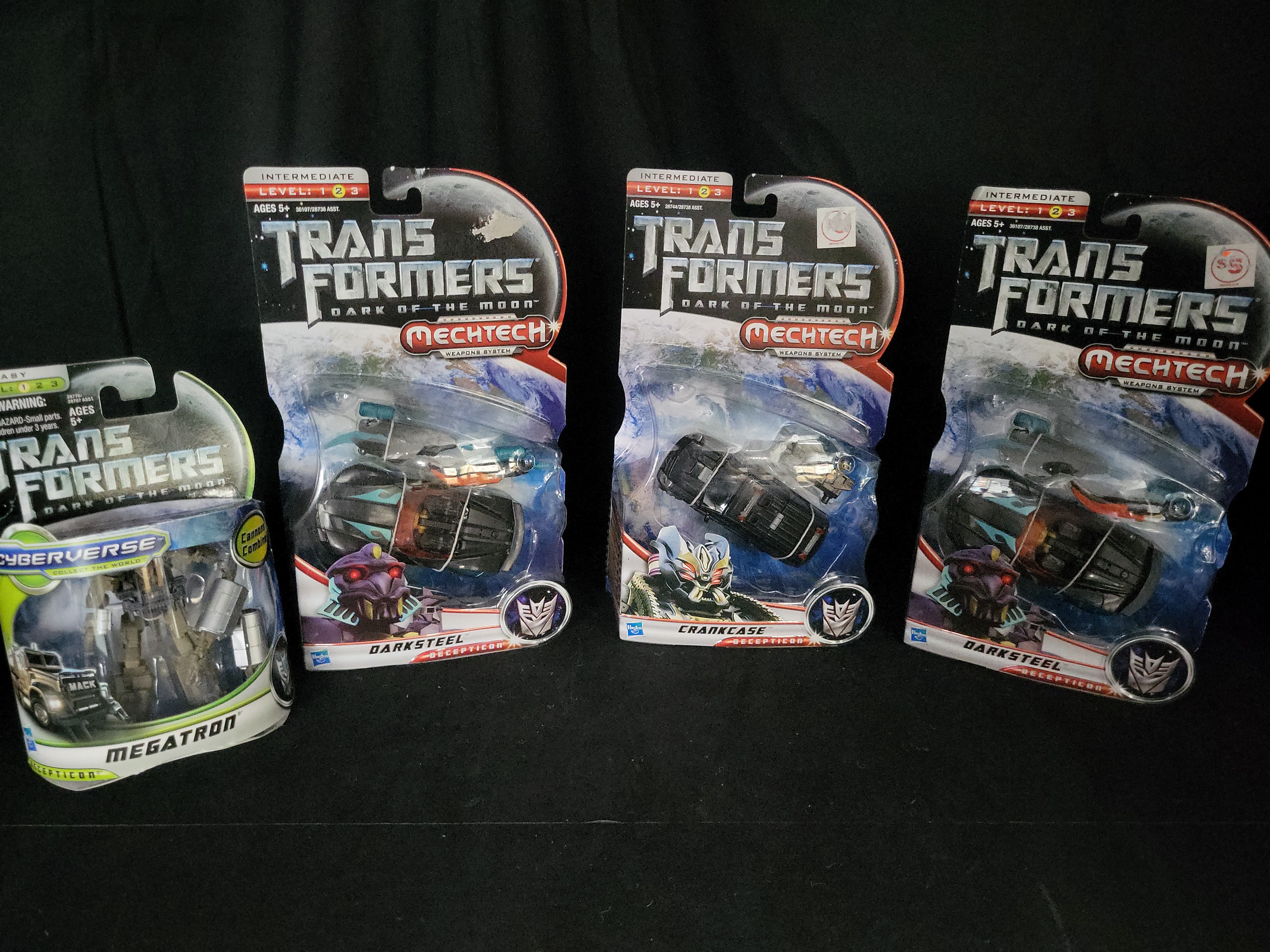 I03545 | A Group of Four Hasbro Transformers Dark of the Moon Action Figures