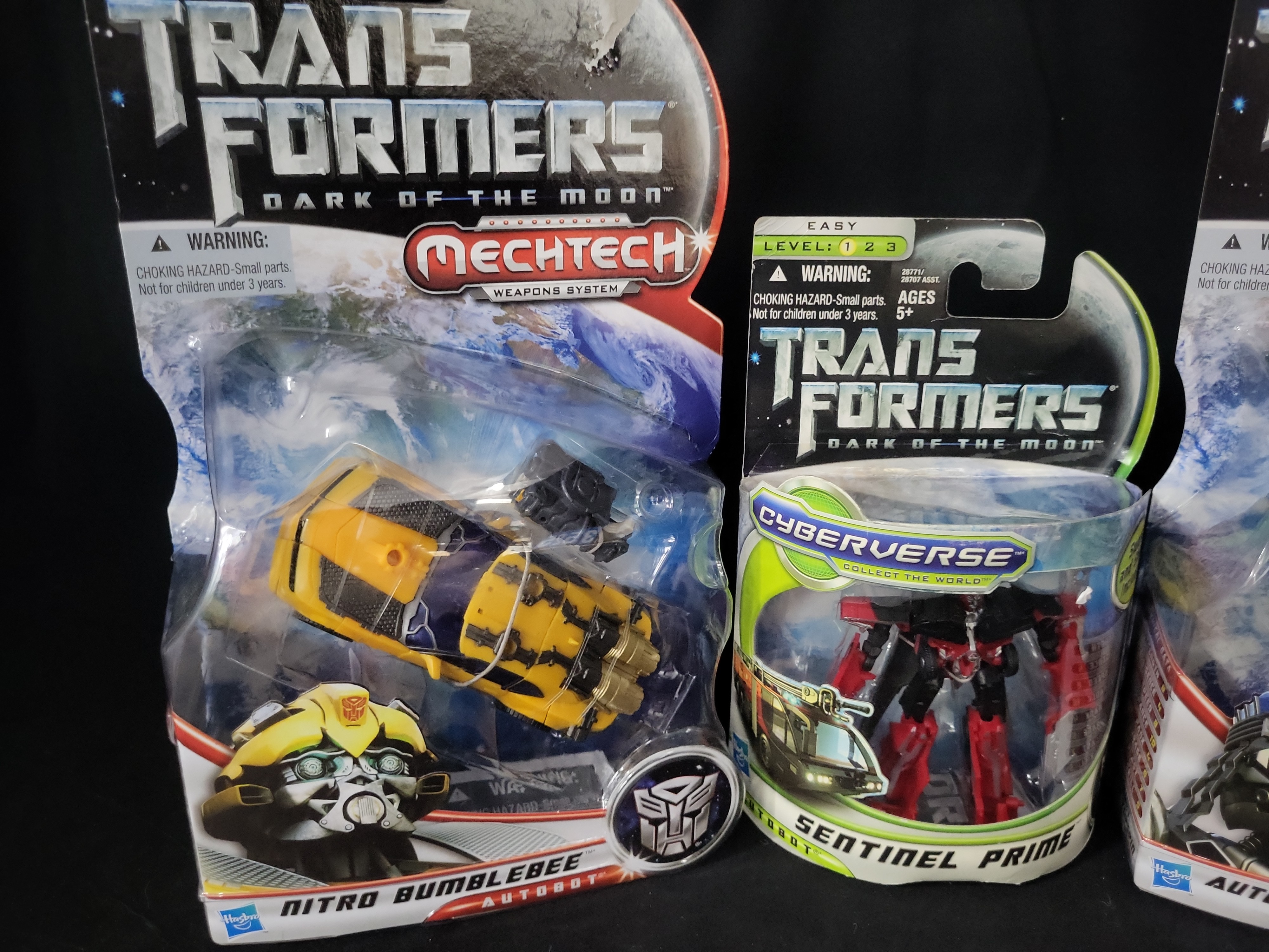 I03525 | A Collection of Four Hasbro Transformers Dark of the Moon Action Figures in Original Packaging