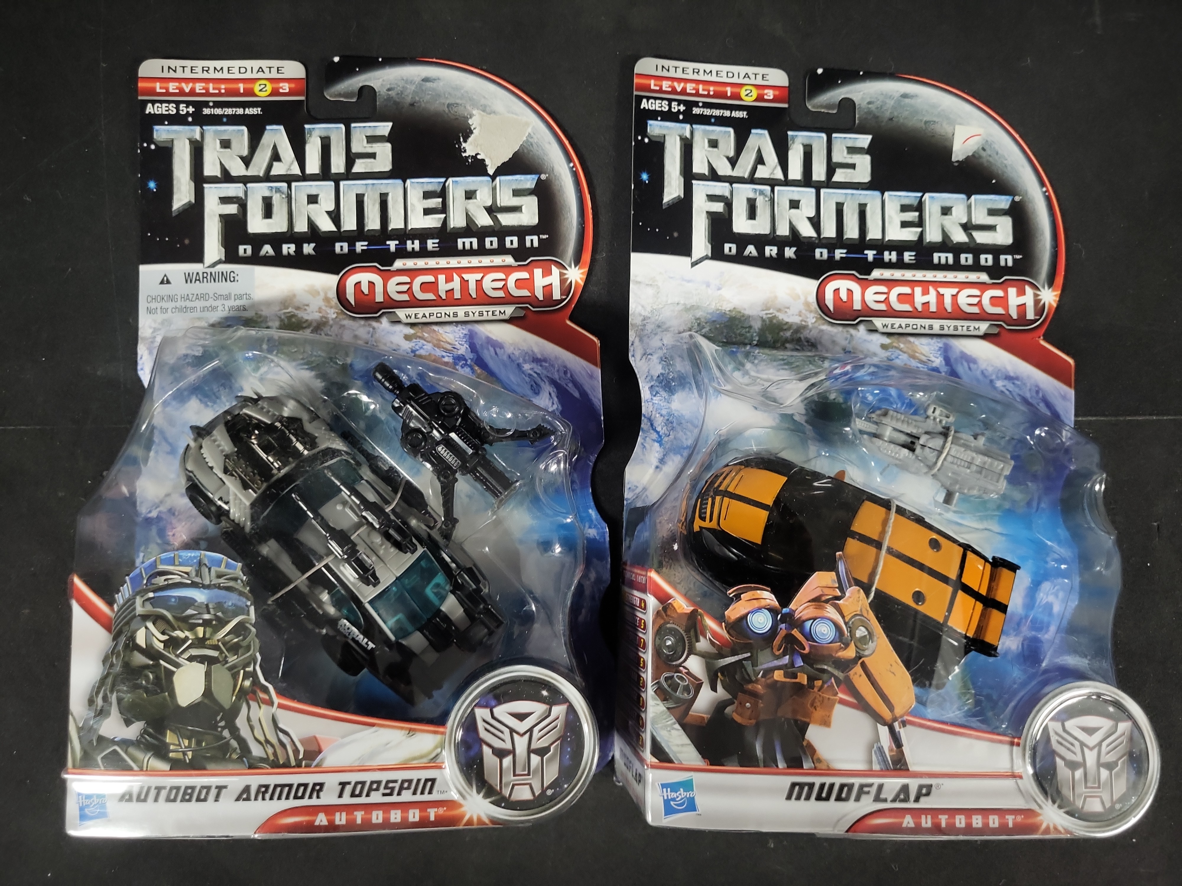 I03525 | A Collection of Four Hasbro Transformers Dark of the Moon Action Figures in Original Packaging