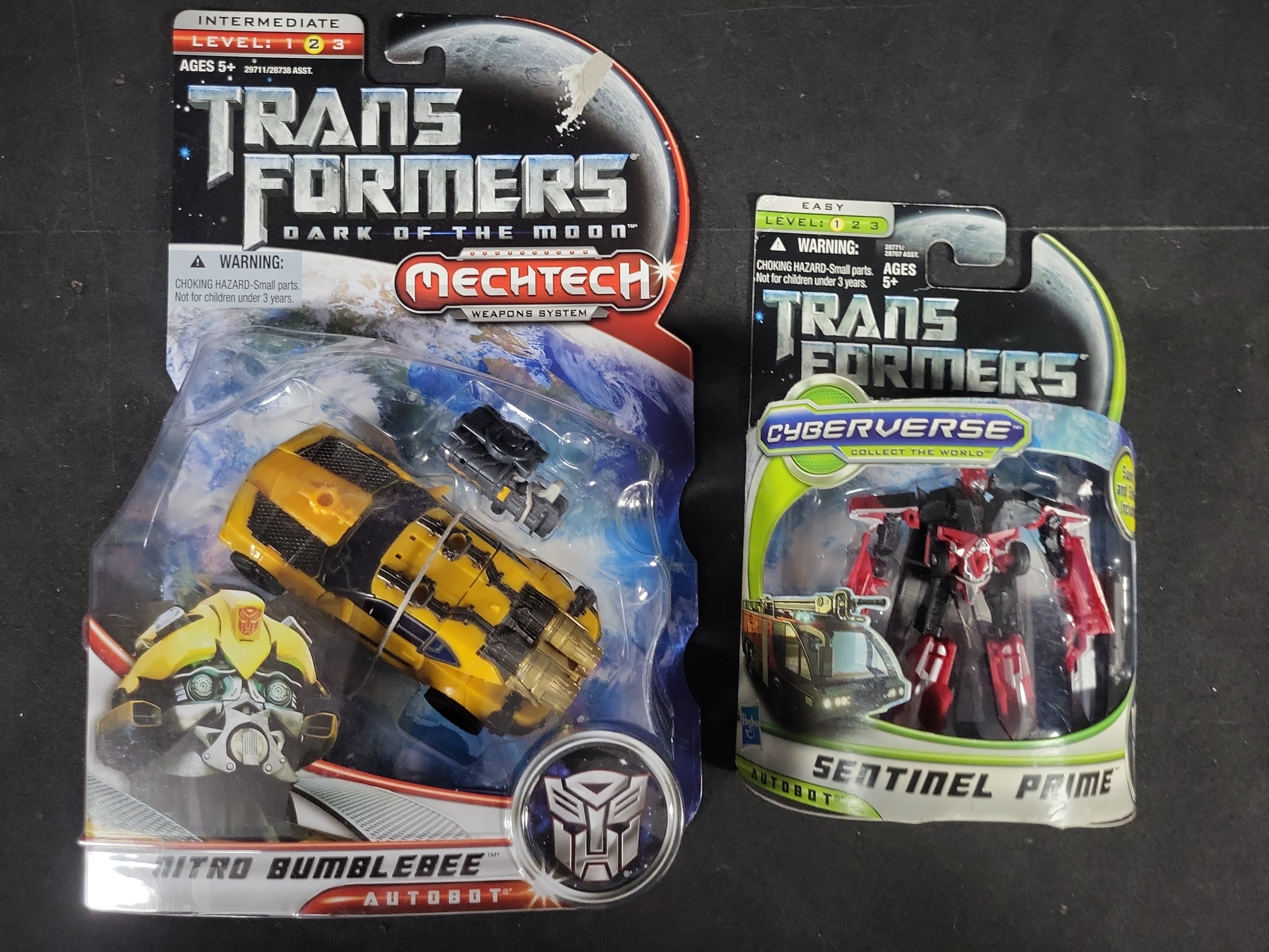 I03525 | A Collection of Four Hasbro Transformers Dark of the Moon Action Figures in Original Packaging