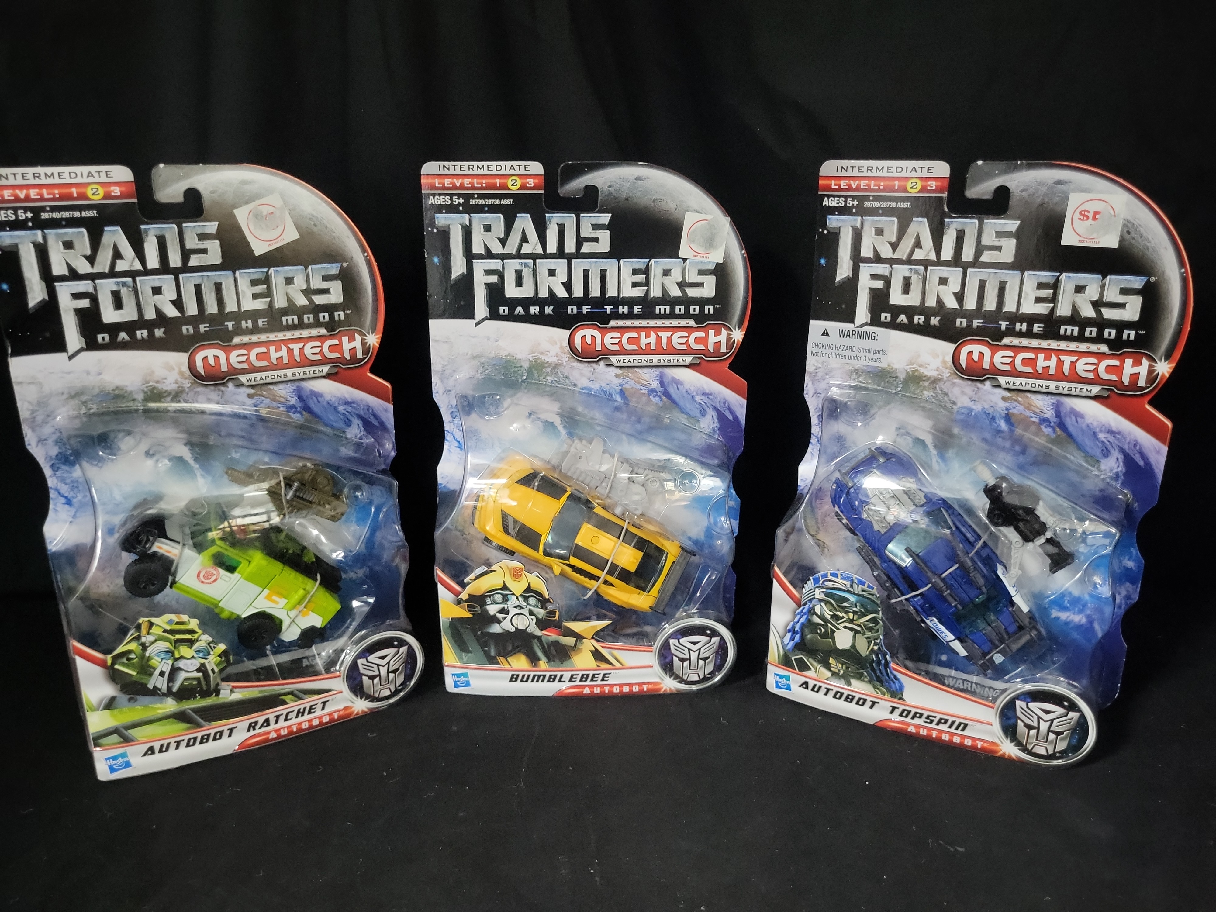 I03537 | Three Hasbro Transformers Dark of the Moon MechTech Deluxe Class Action Figures