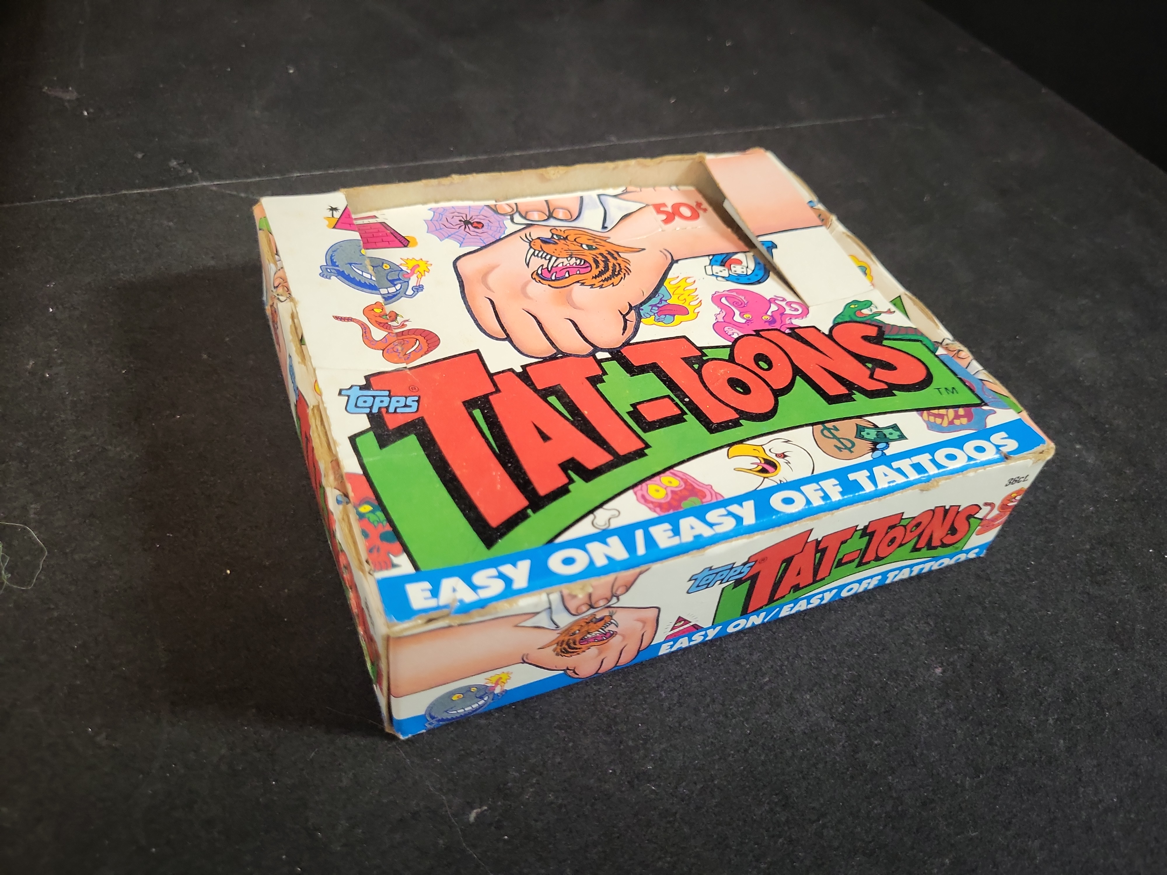 I03660 | A Collection of Vintage Pop Culture Memorabilia and Media Including Topps Tat-Toons and Pac-Man Mirror