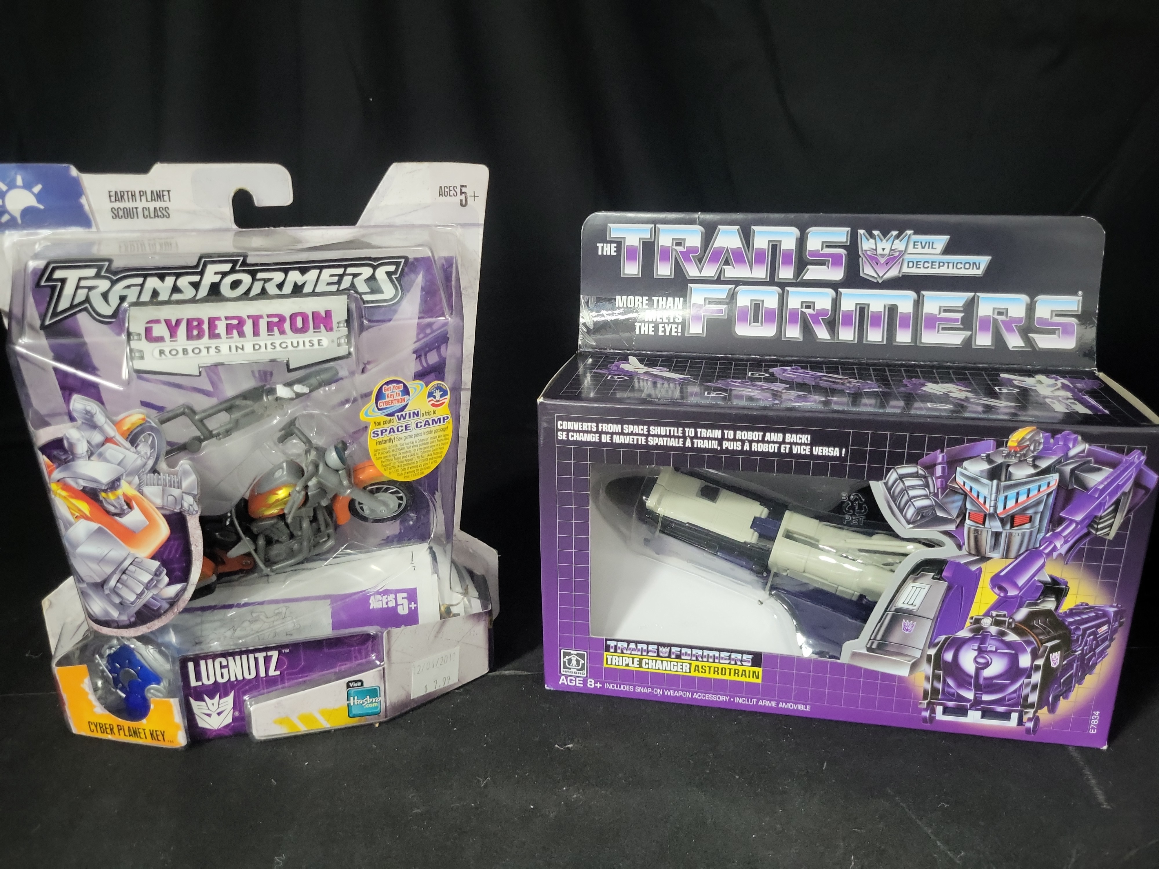 I03540 | Two Hasbro Transformers Action Figures, Cybertron Lugnutz and Vintage G1 Reissue Astrotrain