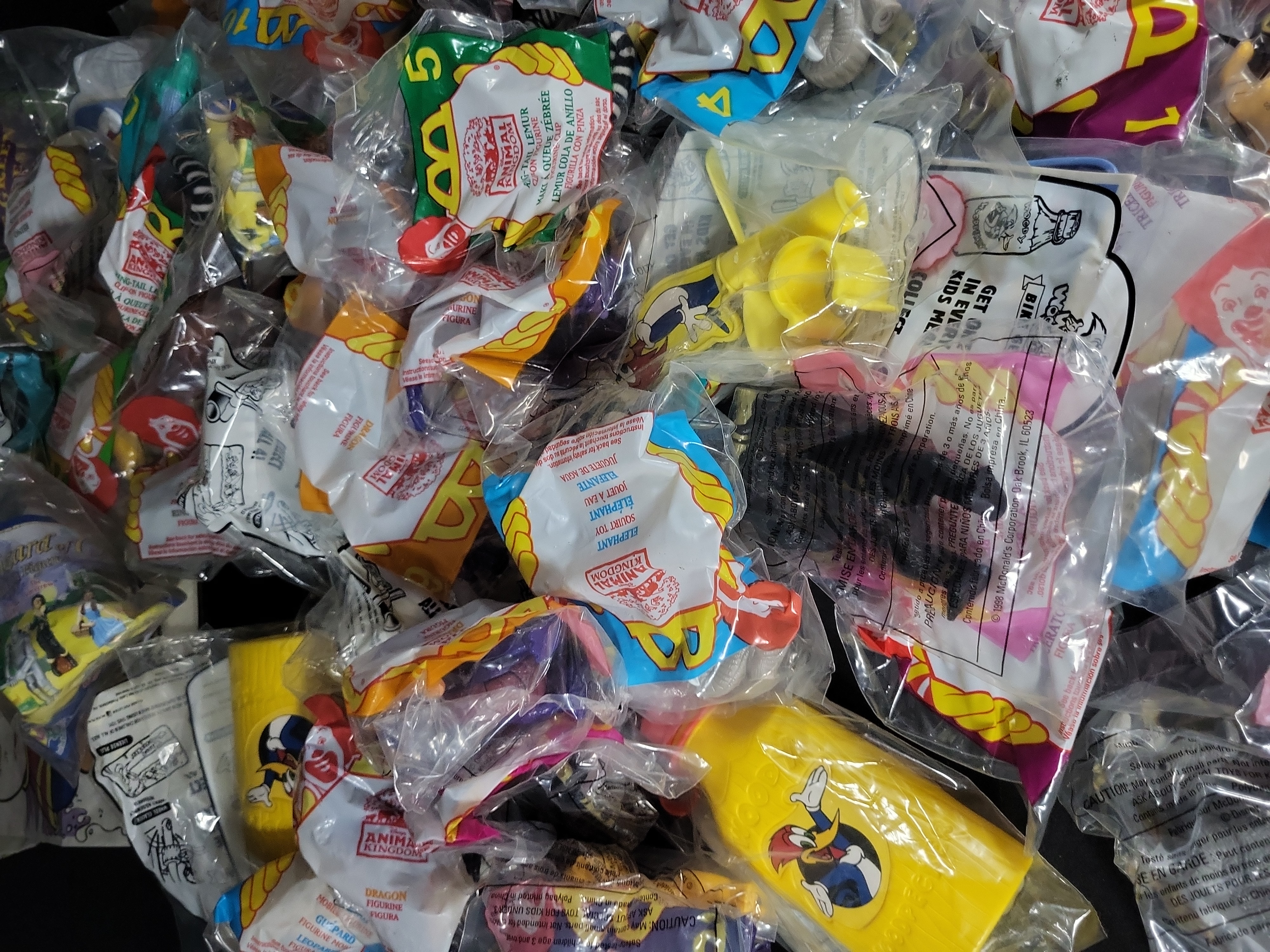 I03174 | An Assortment of Vintage McDonald's Happy Meal Toys and Promotional Ephemera including Disney's Animal Kingdom and Woody Woodpecker