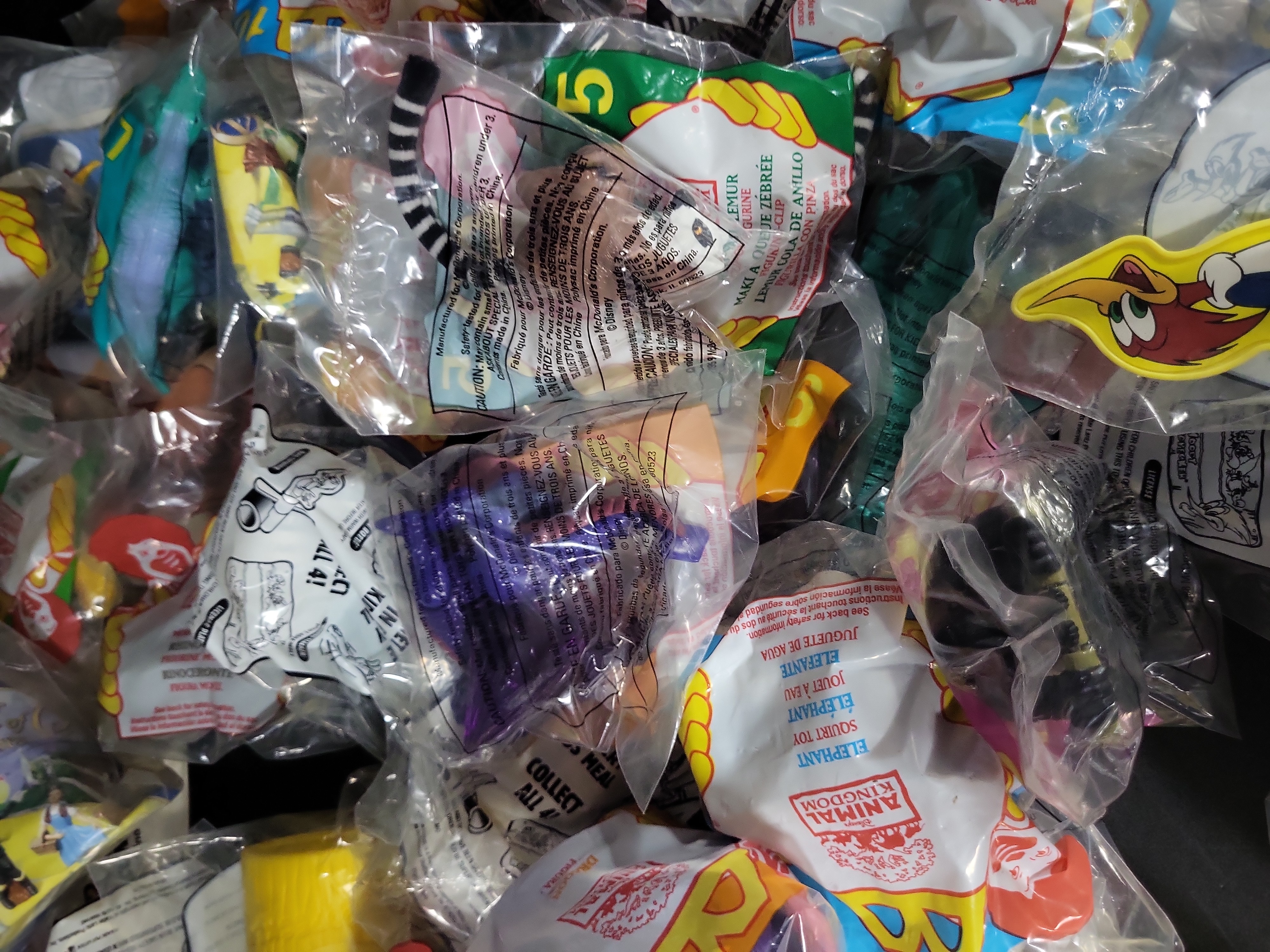 I03174 | An Assortment of Vintage McDonald's Happy Meal Toys and Promotional Ephemera including Disney's Animal Kingdom and Woody Woodpecker
