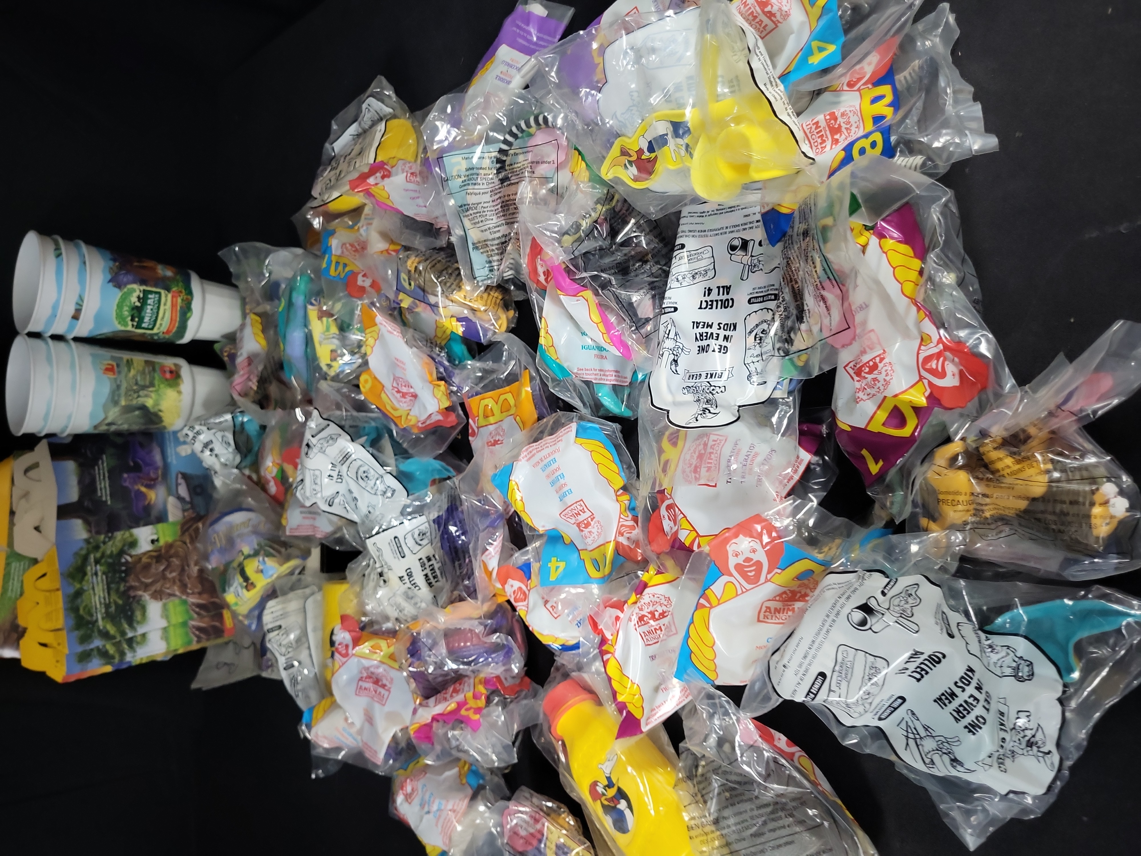 I03174 | An Assortment of Vintage McDonald's Happy Meal Toys and Promotional Ephemera including Disney's Animal Kingdom and Woody Woodpecker