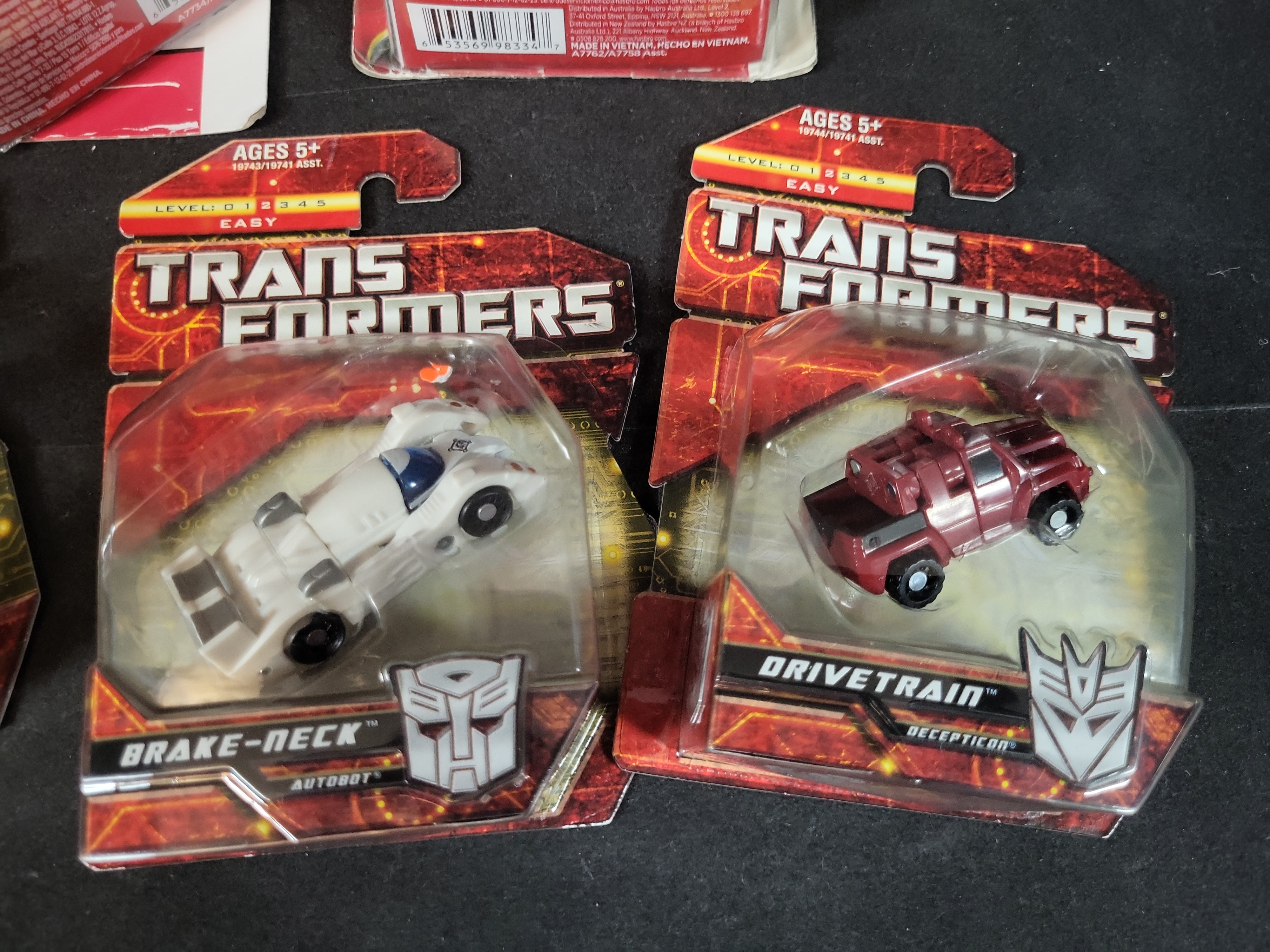 I03511 | Five Hasbro Transformers Action Figures in Original Factory Packaging